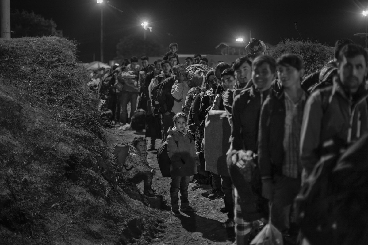  Refugees and migrants enter a registration and transit center in Opatovac, Croatia, on October 7, 2015. Approximately 4000-5000 people, mostly from Afghanistan, Iraq, and Syria, pass through this border town every day on their way to Western Europe.
