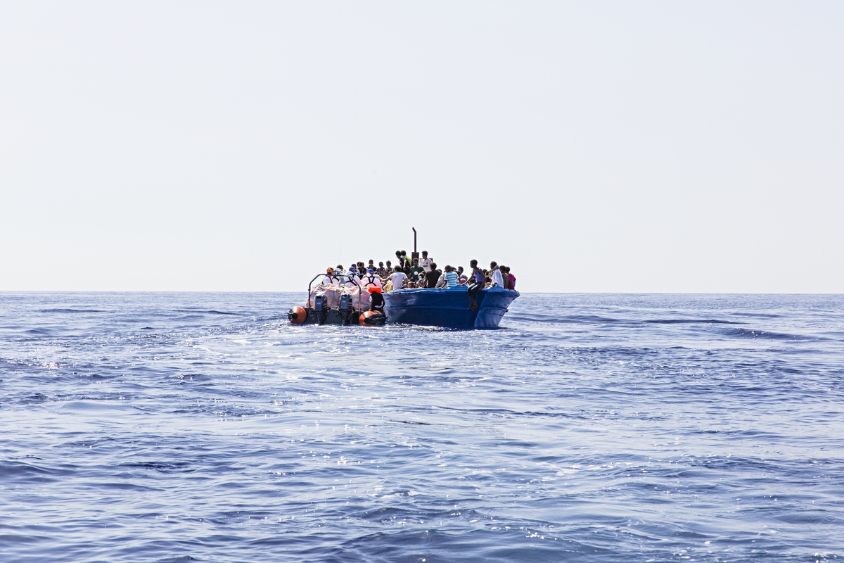 Strait of Sicily, September 2, 2015. Eritrean migrants are seen in their boat as they are about to be rescued 40 miles from the Libyan coasts by a ship hired by MOAS and MSF (Medecines sans Frontieres). The ship named "Phoenix" was patrolling when the two drones found 3 wooden fishing boats coming probably from Zuwara (Lybia).