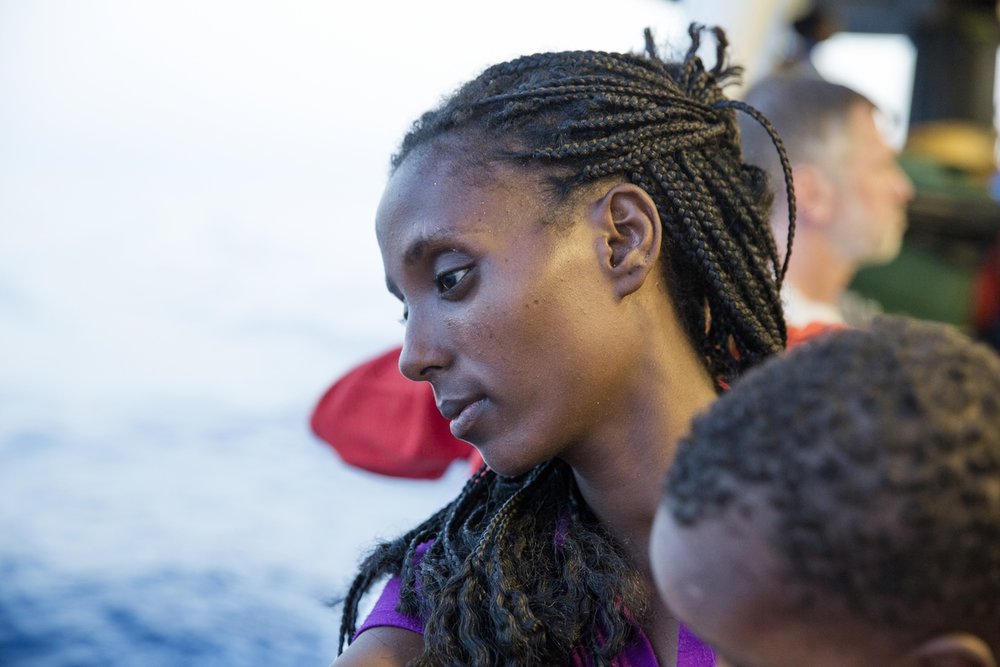     Strait of Sicily, September 3, 2015. During the 48 hours of sailing to the Italian port of Reggio Calabria, refugees from Eritrea, rescued by MOAS/MSF operation, are sadly looking to the sea. 