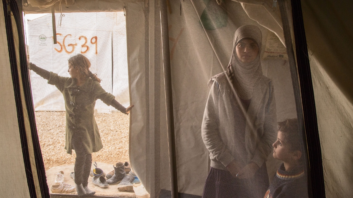  Reem, 13, spends time wither her siblings in her family tent at the Al Za'atri refugee camp for Syrians, near Mafraq, Jordan on Nov. 18, 2013. Reem is a Syrian refugee suffering from mental health issues. While she was in Syria, Reem witnessed sever