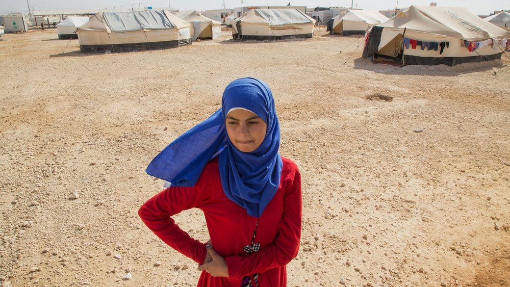  Reem, 13, spends a quiet moment alone at the Al Za'atri refugee camp for Syrians, near Mafraq, Jordan on Nov. 25, 2013. While she was in Syria, Reem witnessed several armed conflicts, killing, bombing and kidnapping. Refusing to attend school, Reem 