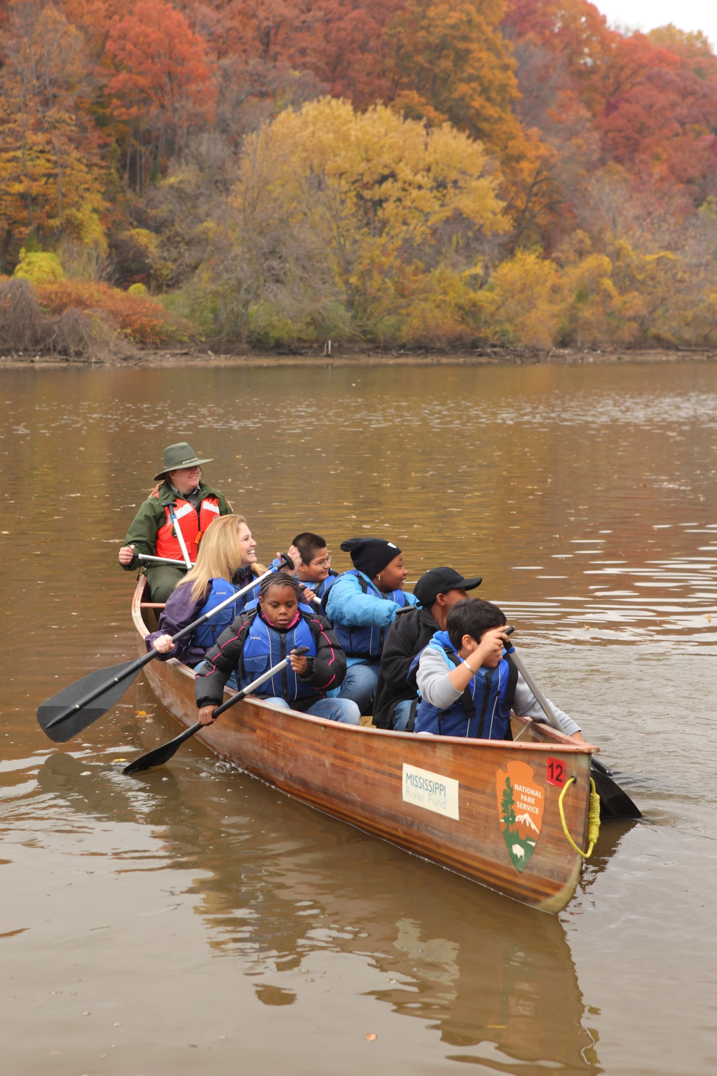 Kids canoeing on a river