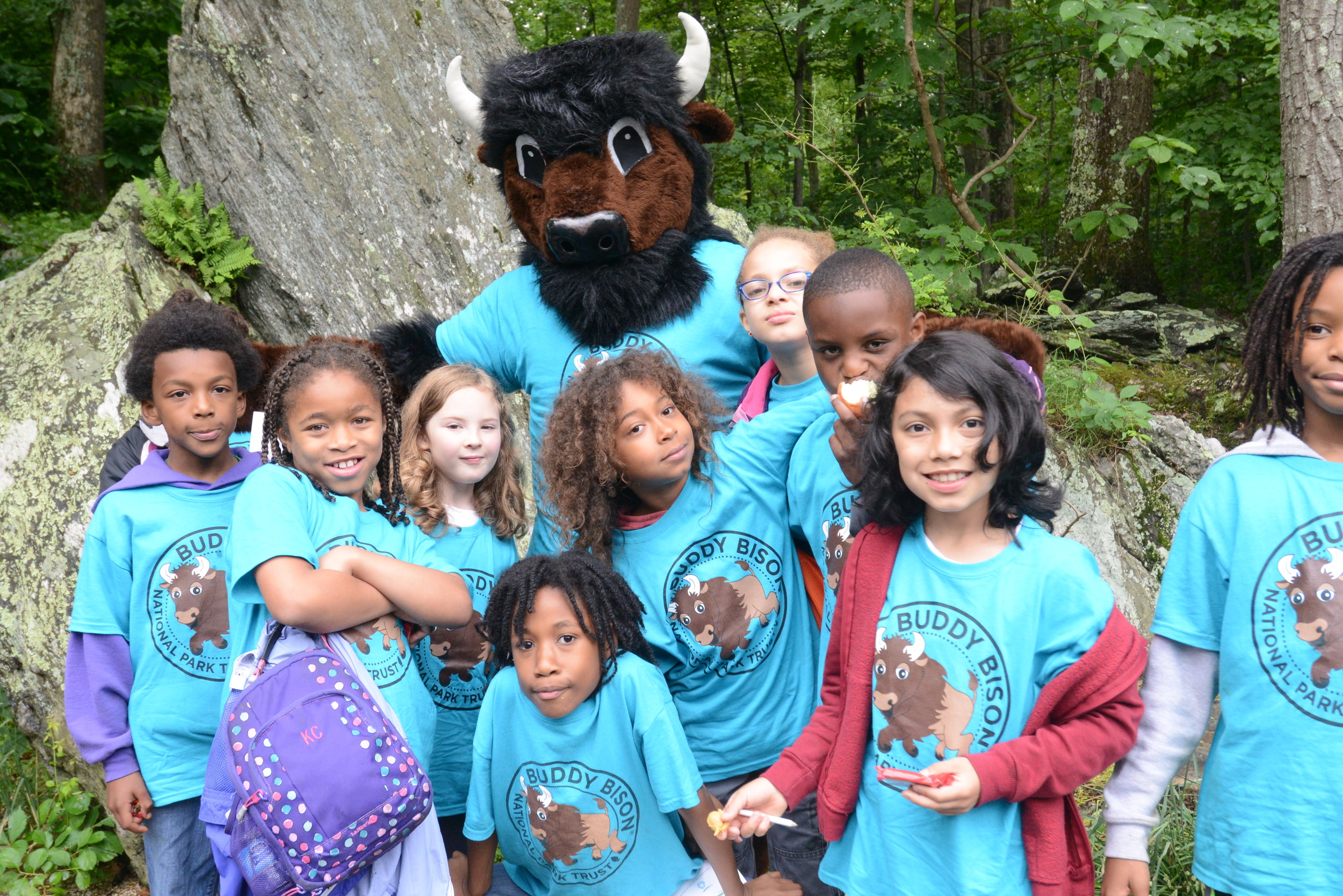 Children participate in an outdoor recreation program with Buddy Bison of the National Park Trust