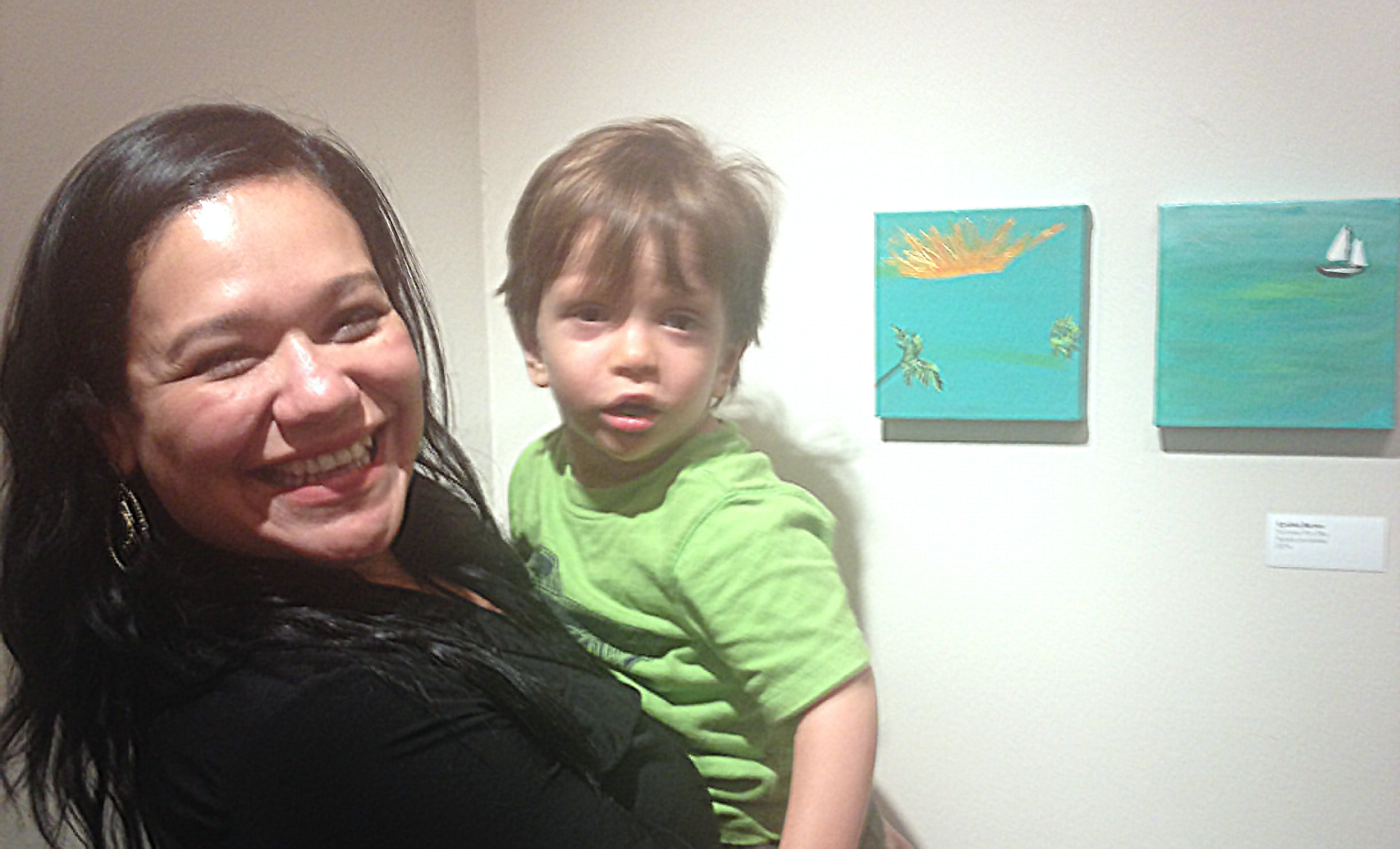 Cynthia Barron and her son at a company art show opening.