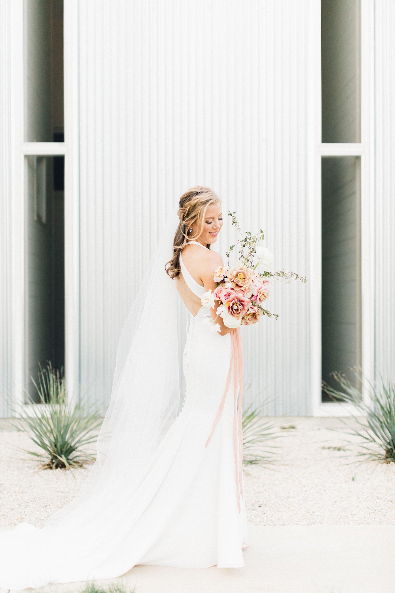 Bride with flowers in Portland by Color Theory Collective