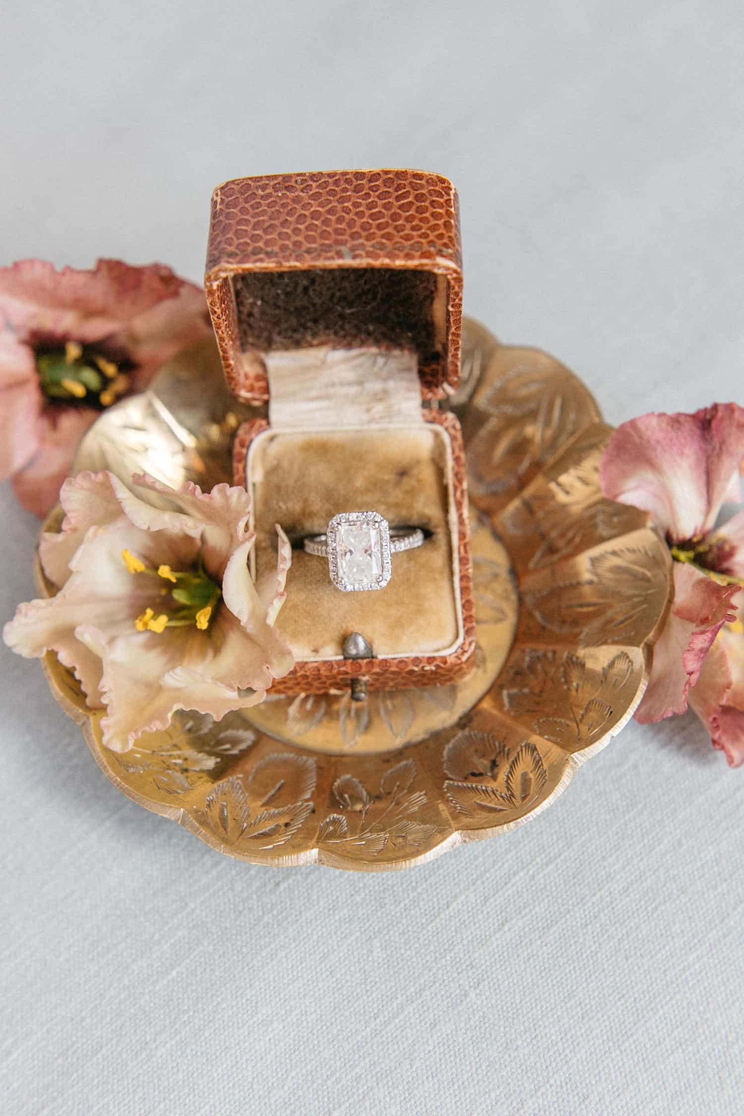 Wedding ring & flowers by Color Theory Collective