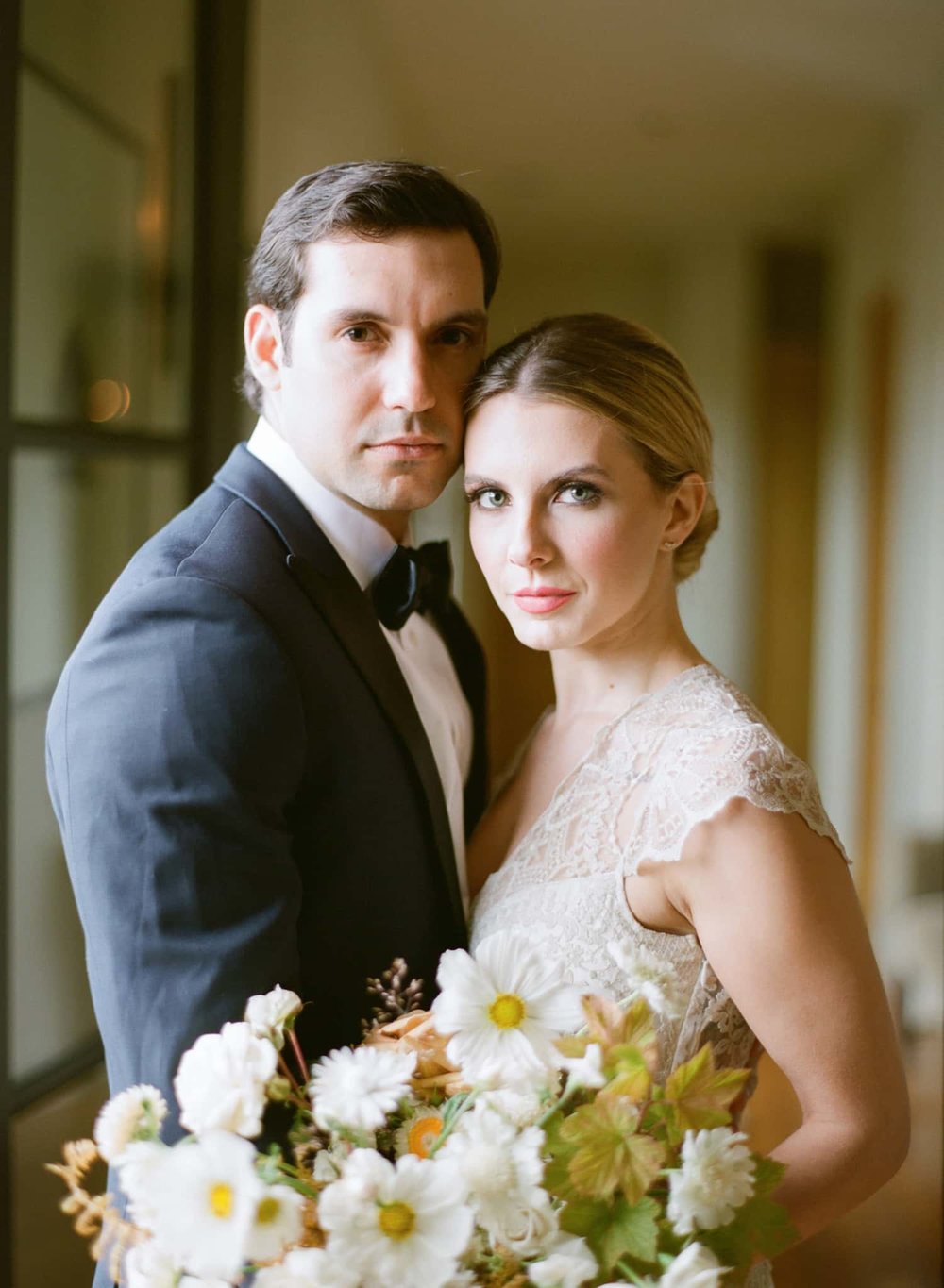 Portrait of Bride and Groom with bouquet by Color Theory