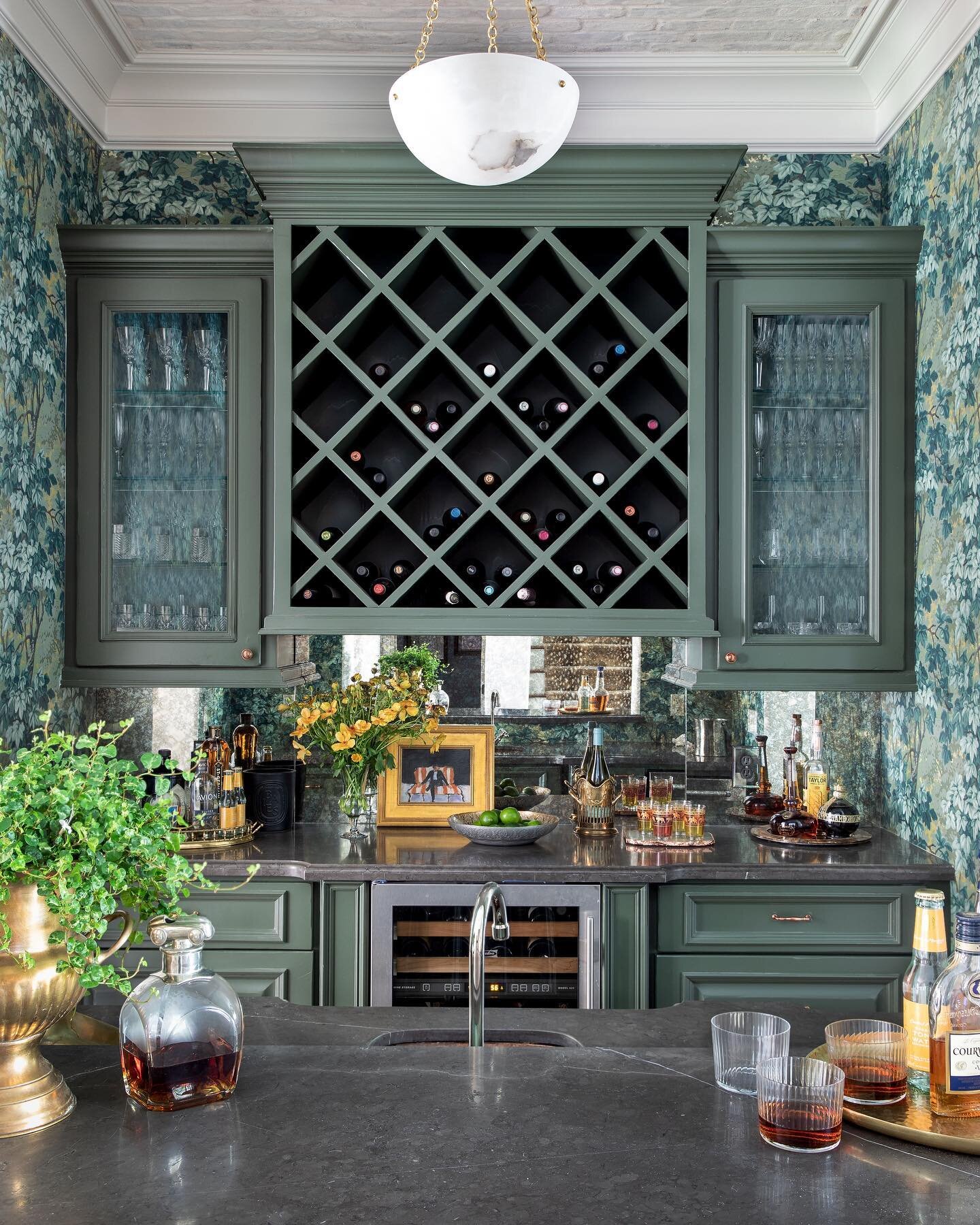 This jewel box of a bar got a complete refresh from paint, backsplash, countertops, and lighting to that killer wallpaper. Thank you @wileyhomesllc for helping us make it all happen! ⚡️💚🥃 photo: @kerrykirkphoto styling: @curiousdetails