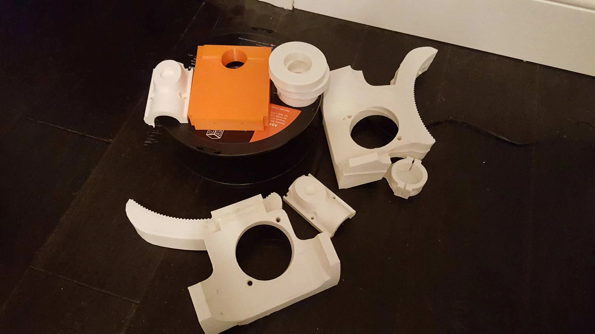 This pic above shows my "part graveyard" from just this week. I think the overall takeaway from this project with regard to 3D printing is going to be "just because it works in CAD doesn't mean it's going to work in real life." I have a lot to learn about tolerances, printing thresholds, and fittings. The main motor mount is driving me up a wall right now. Or actually, it's not driving anything because I can't print it properly. The original one was printed in two "odd shape" pieces and my overzealous self didn't take enough care when attaching them and the curved rack had a bit of a tilt to it. Normally I'd let it slide but since this assembly is arguably the most important part of the drive, I had to be a bit picky. My second iteration was not well-thought through and now sits next to the original. Version 3 of the motor mount is just an "idiot-proof" version of the first iteration, so hopefully I'm not THAT much of an idiot. The other parts had various fitting issues.