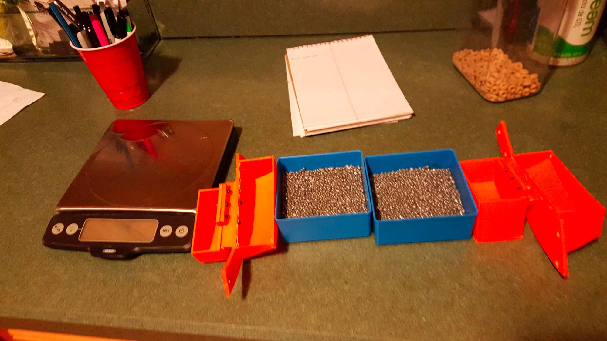 Orange saddlebags getting test filled and weighed. 