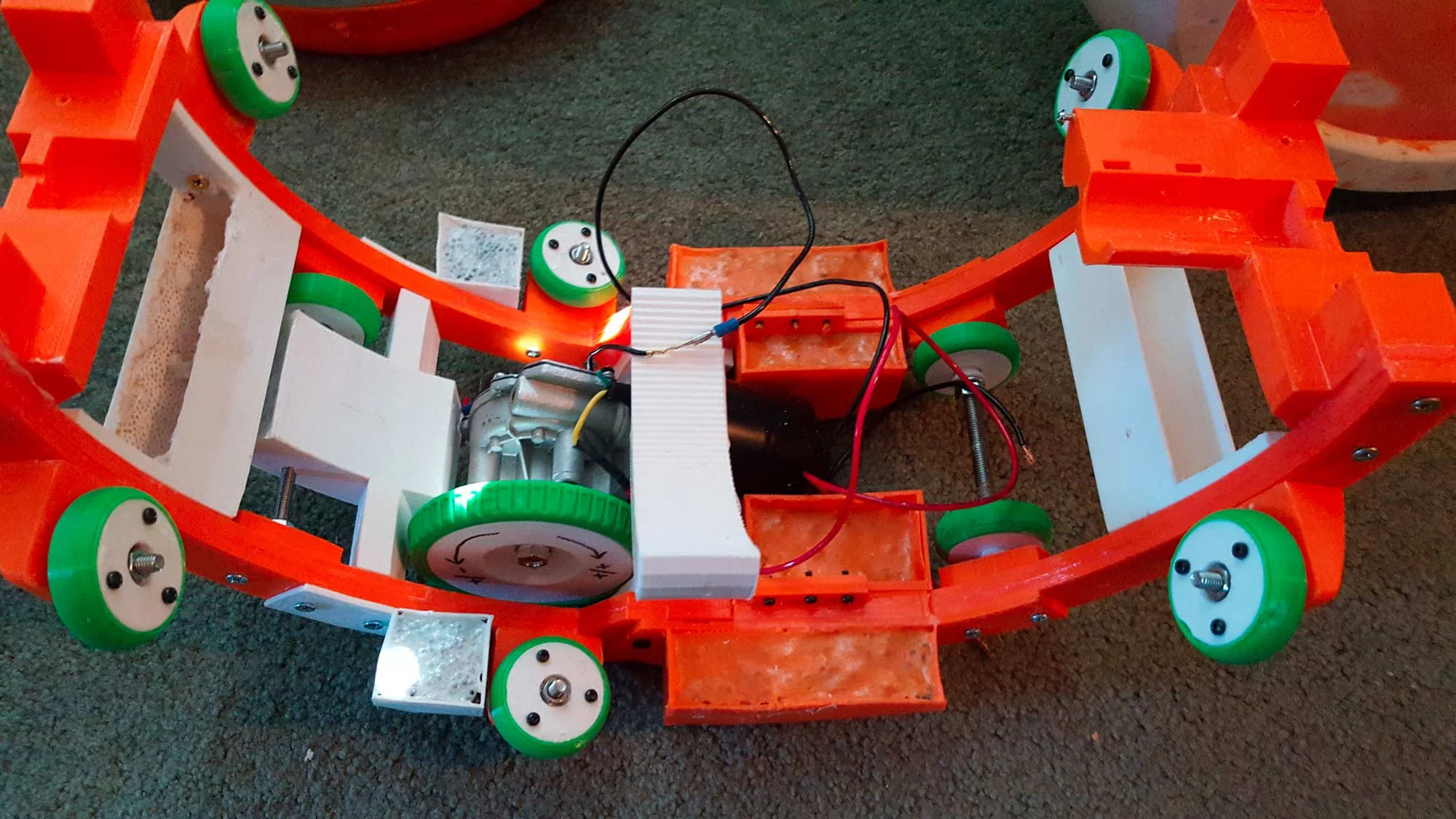 I decided the best bet was to take the weight out of the highest point, to keep the added mass as much above the main wheel as possible. After I did that I had a lot of extra room in my little 'bananhanger' so I decided to build another one for the other side so I can add balanced weight in the future if I needed to.