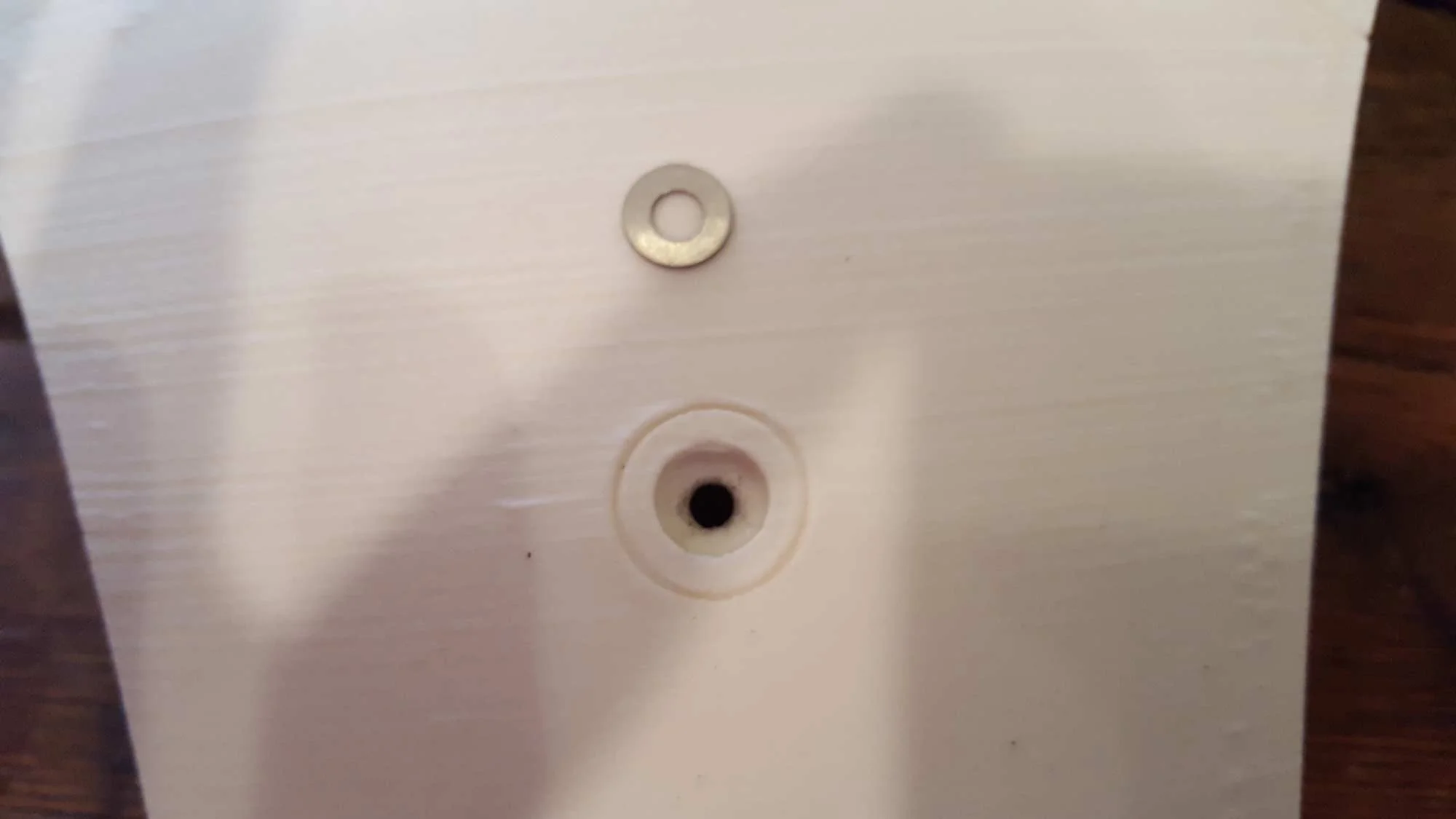 On the triangle side, I was noticing the profile of the screw was starting to wear away the plastic on the inside. So I bought some PERFECTLY sized washers to fit in the holes. 