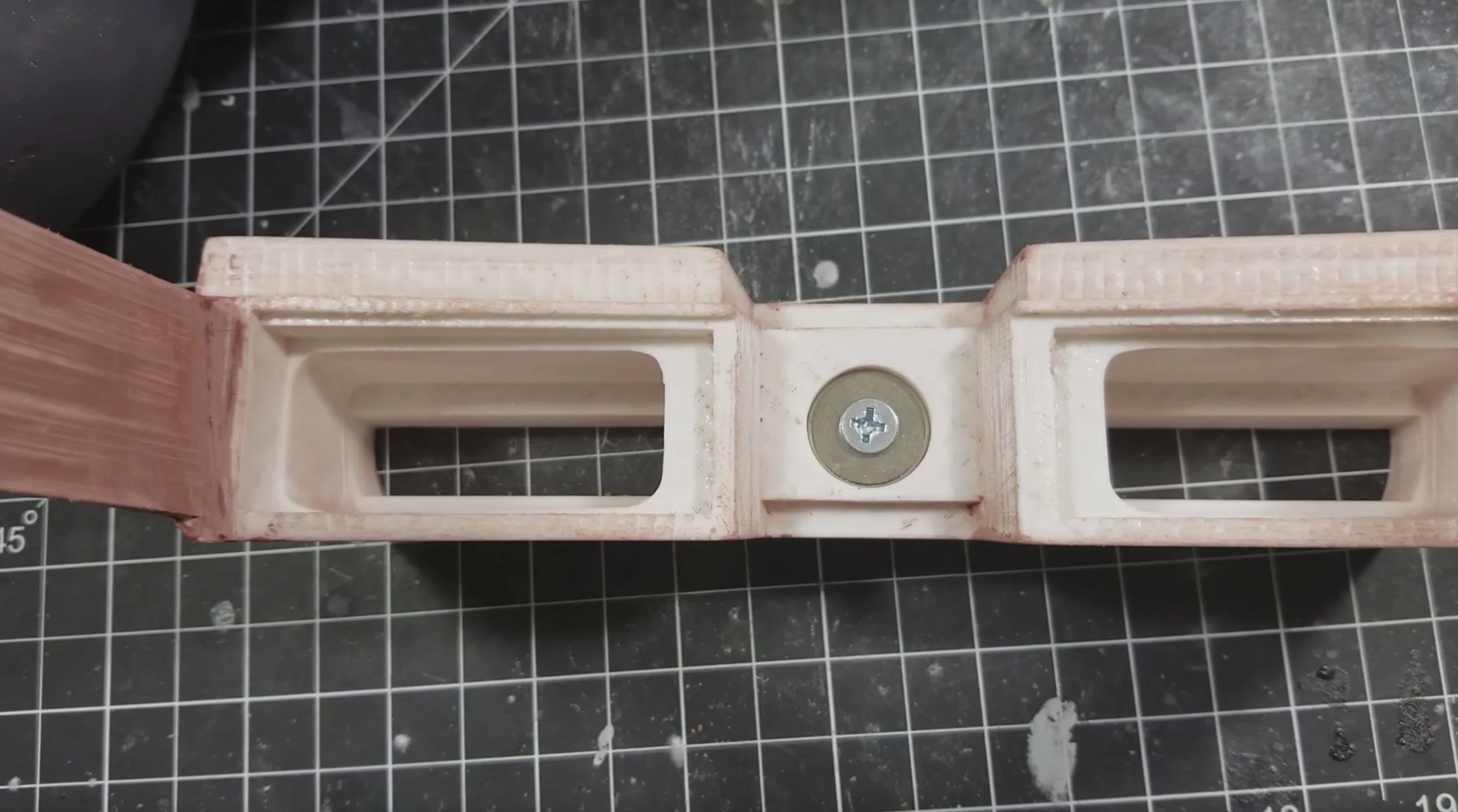 So one of your magnets will install in the bridge of the binocs here. I purposely included a round cap #10 screw with this. The recess for the magnet is also intentionally very deep (twice as deep as the magnet) This is so you can manually dial in the stregth of the magnet. If you make the magnet flush with the surface of the glasses, it will very likely be too strong and you'll have a hard time pulling them off and it may even bend your plastic towards the center. The closest you should get is where the round cap of the #10 screw is flush with the bridge. This is where my final install ended up. If you find this isnt' strong enough, you can switch to a flat head screw and make it flush (any number 10 screw will work). If you find this is too strong you can keep screwing in the screw until the magnet is flush with the back of the recess. Magnet decay is expontetial, so even a millimeter of distance will have a huge affect on the retraction. Take your time to dial this in as you like. 