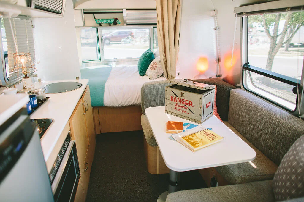Cozy cuteness inside our rented Bambi. One night in here and we were totally sold on Airstreams. Photo by The Vintages .