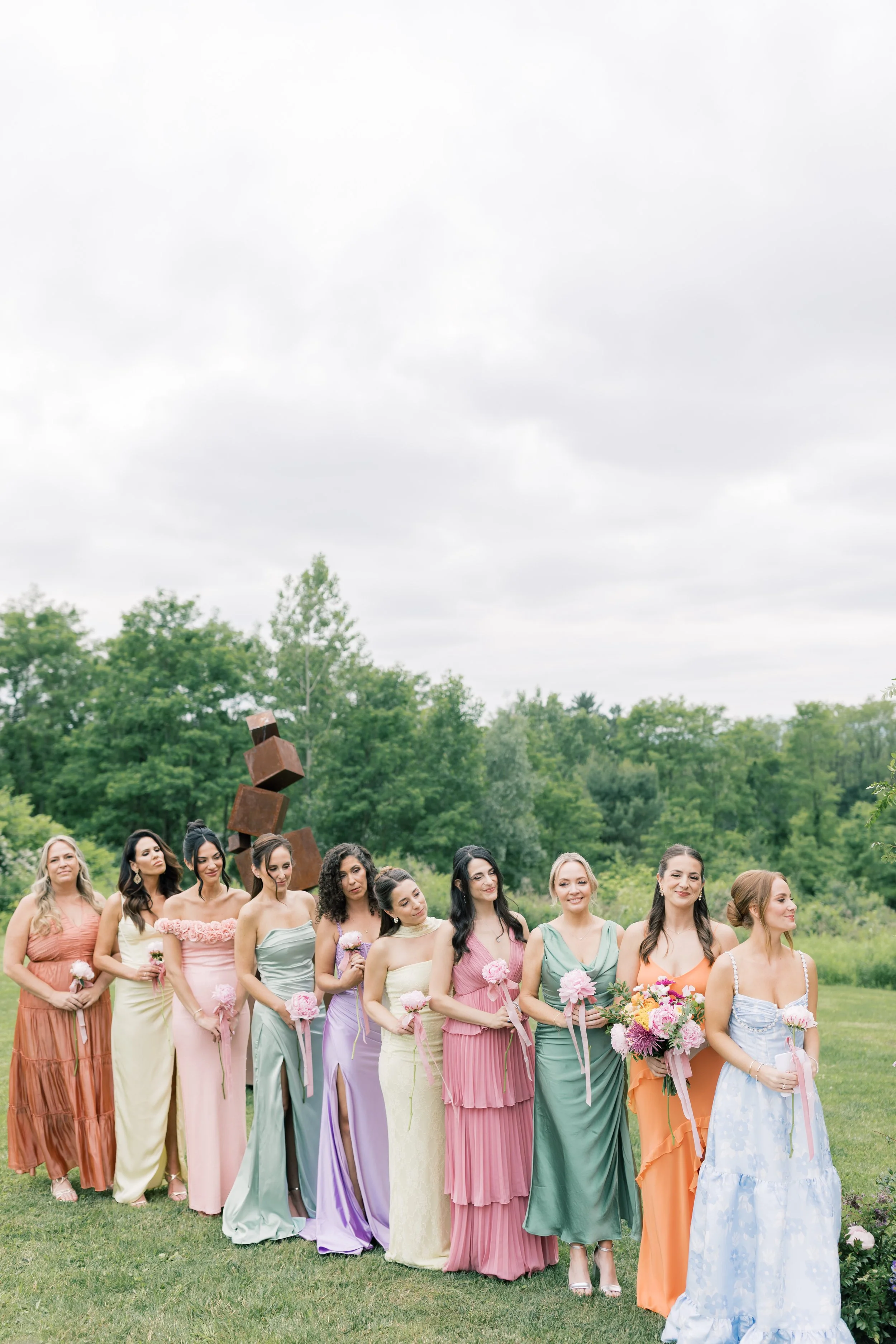 bridesamaids in colorful wedding dresses at berkshire mountain wedding