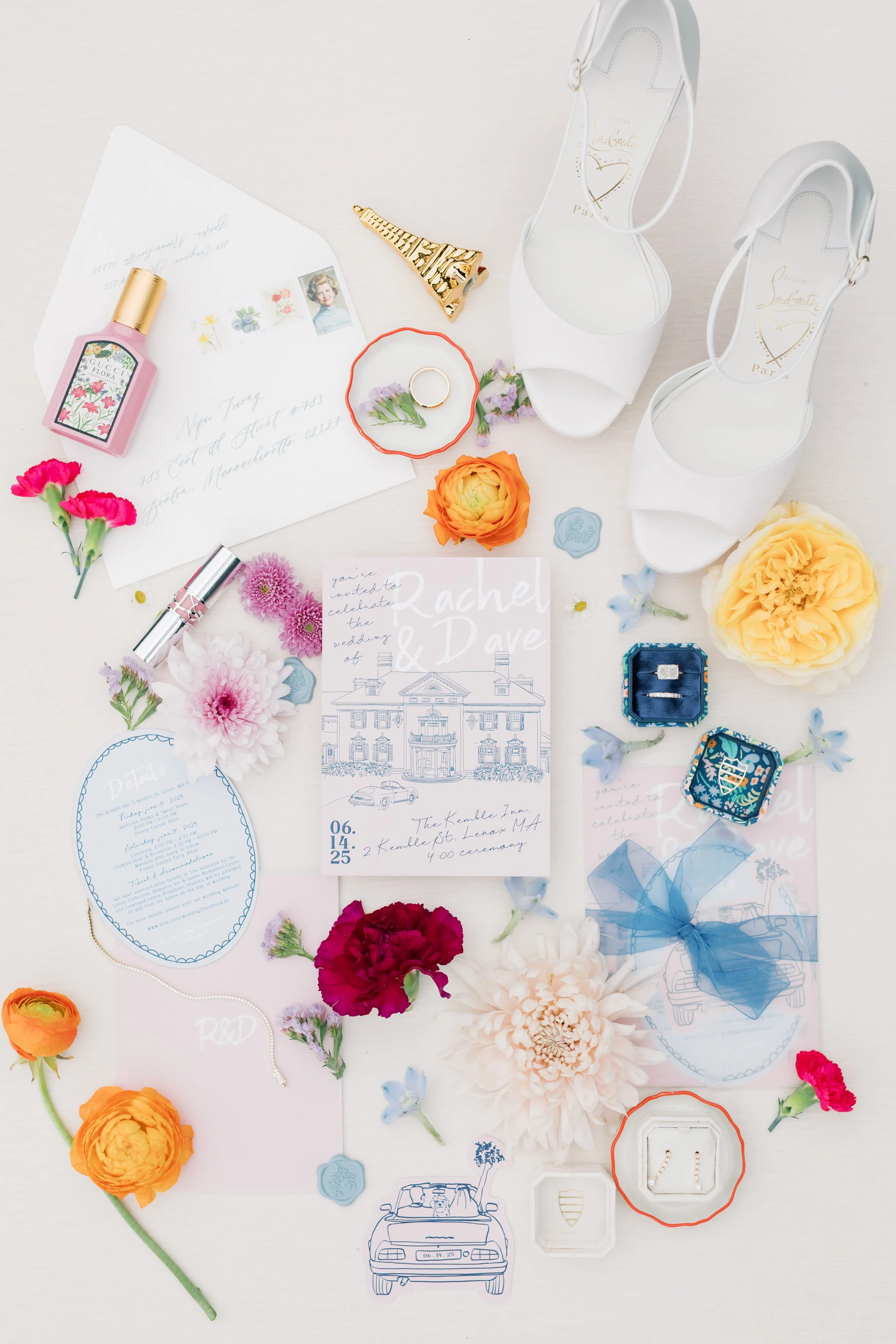 flatylay of paper goods and details at kemble inn wedding