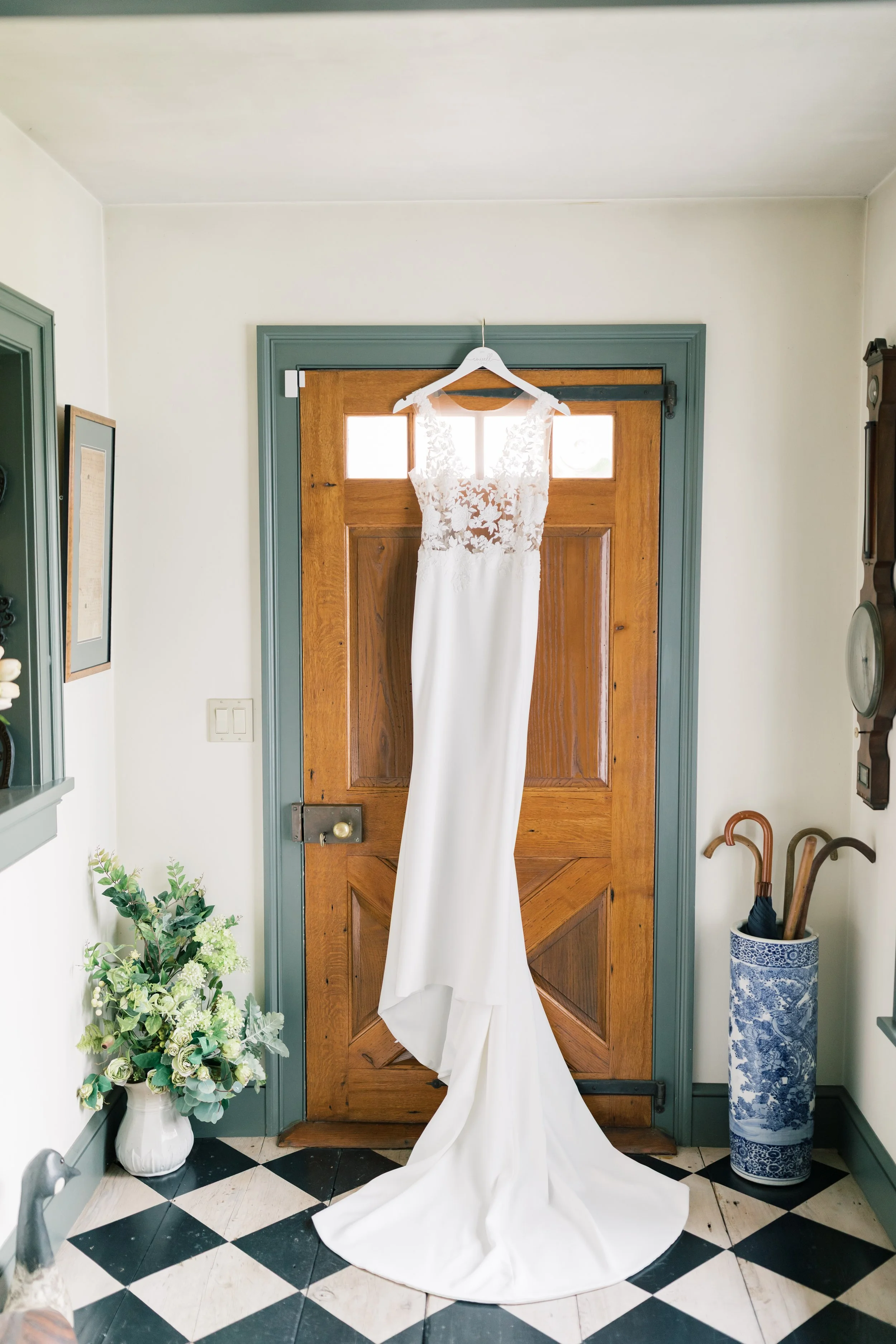bridal gown hanging in smith farm gardens entry