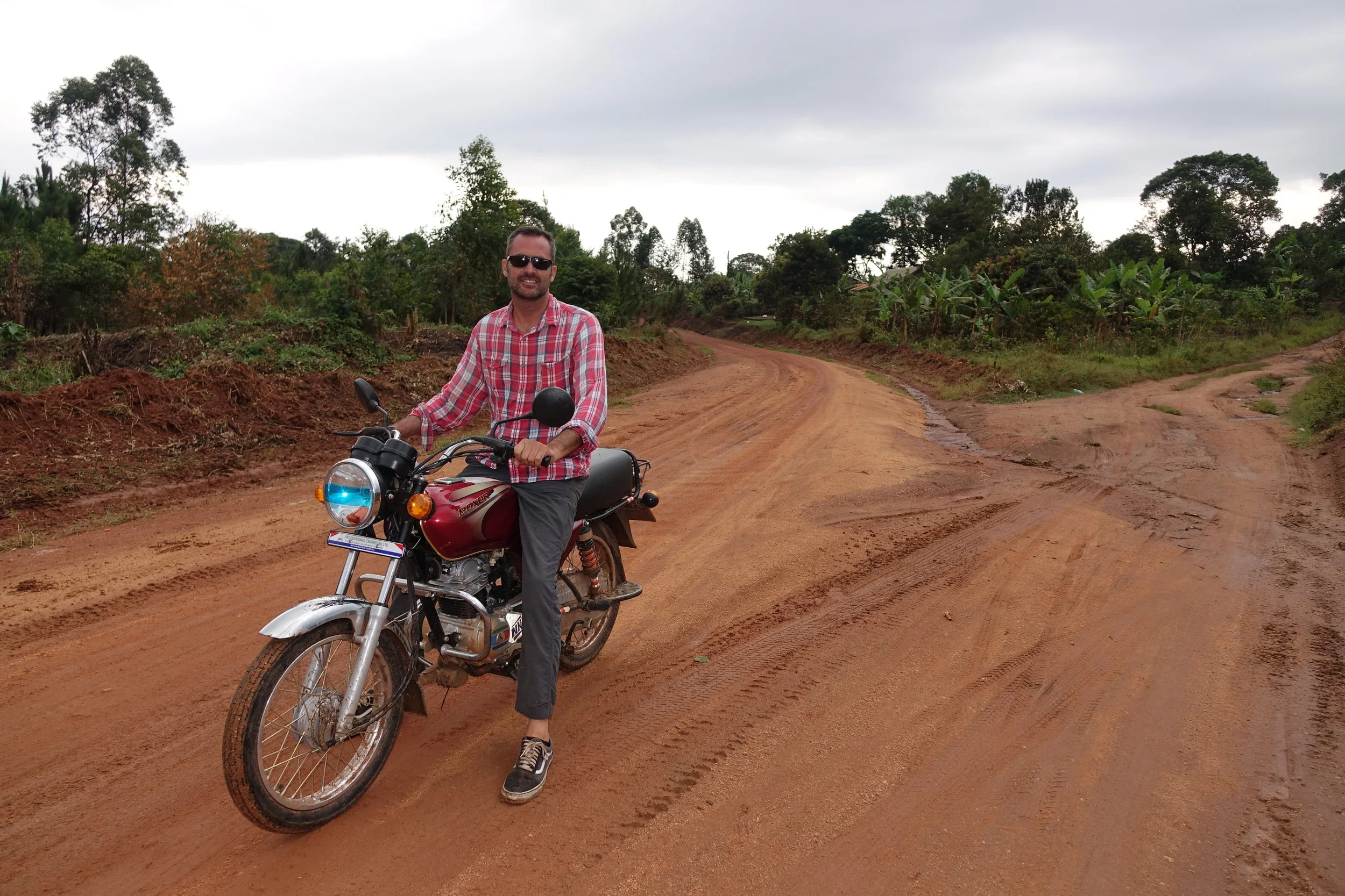 World Riders Foundation founder, Mike Haley, on a boda boda in rural Uganda. 