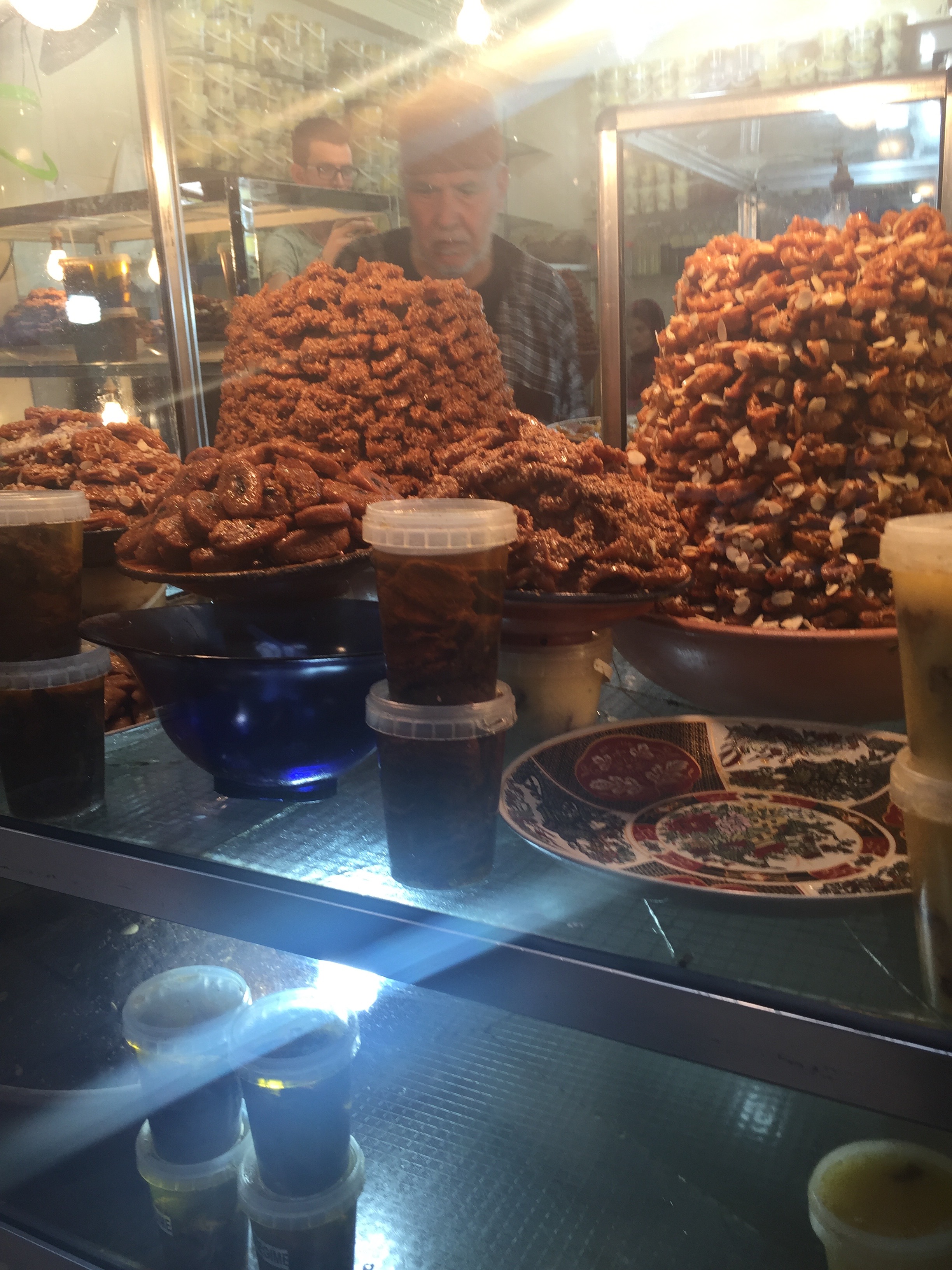 These are some sort of fried thing with honey. Not great. But I put it in my mouth. 