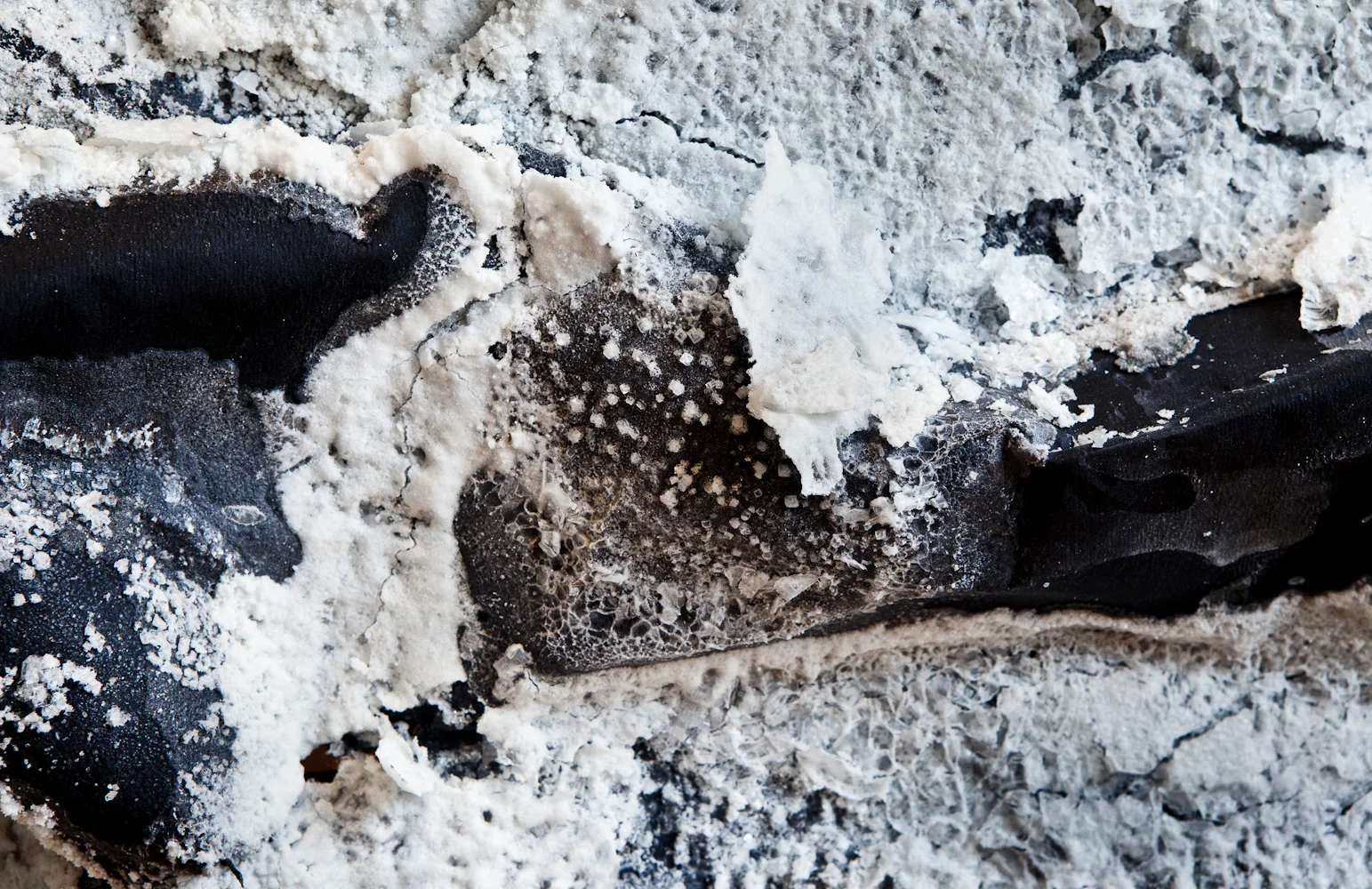 "The Tide," 2015, black paper, salt crystals, found rope and branch, 11 x 3 x 5 feet, Image Courtesy of Daniel Kukla