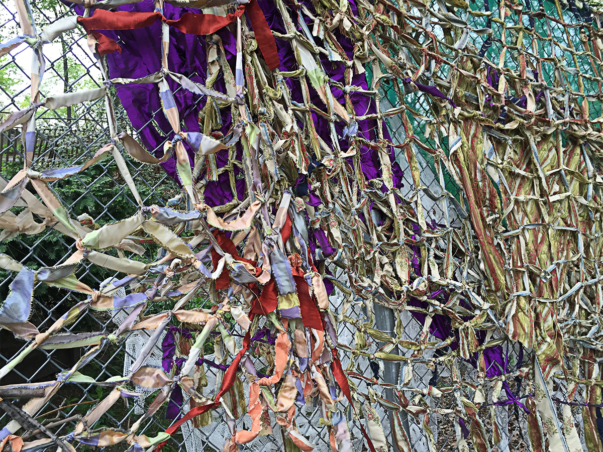 "Permeable Threads," 2016, woven fabric, branches, tarp, 8 feet x 79 feet (Flux Art Fair 2016)