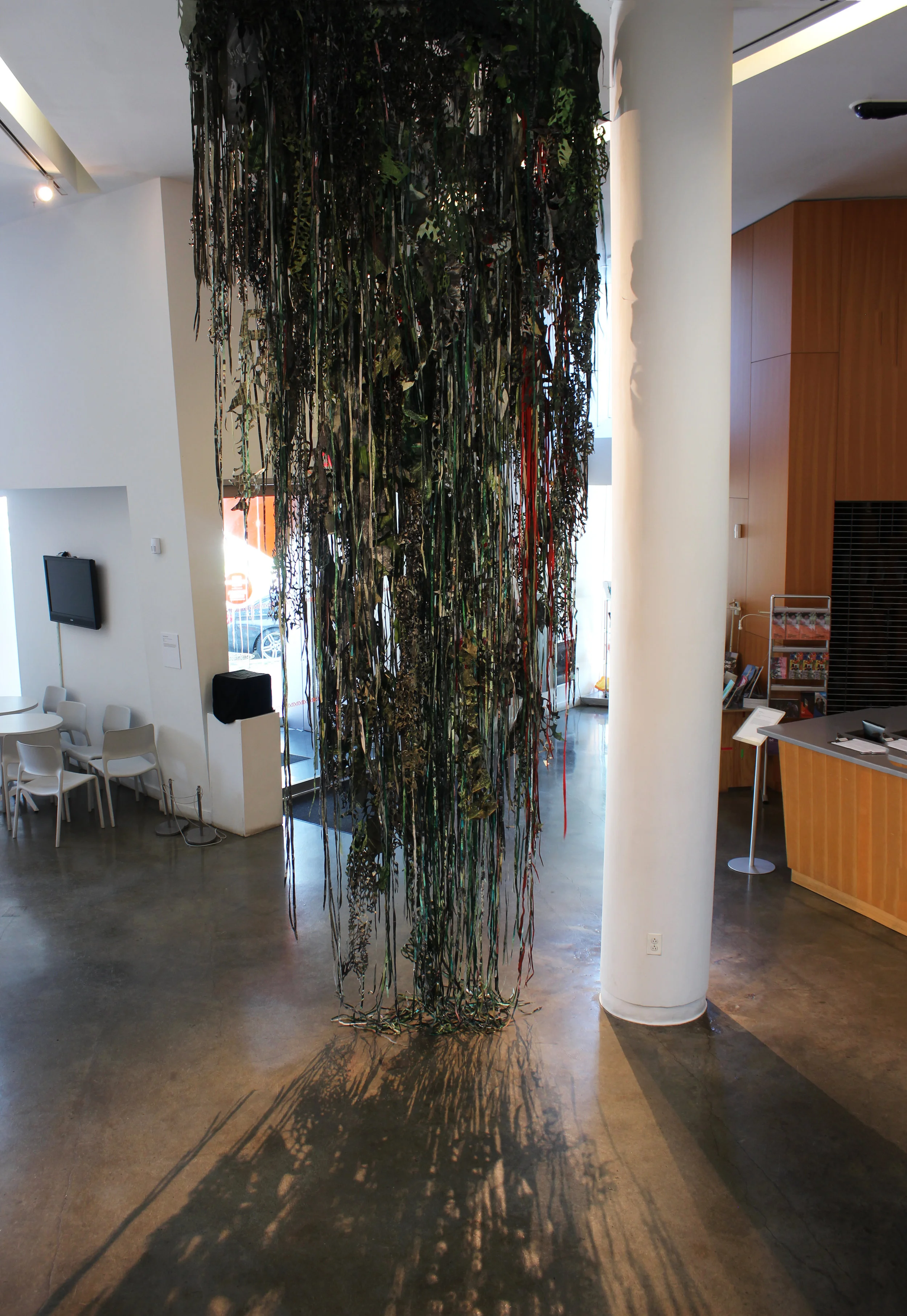 "Nostalgic Fatigue," 2017, Cut, dyed and painted colonial photographs of the Philippines (late 19th/early 20th century), 17 x 6 x 1 feet