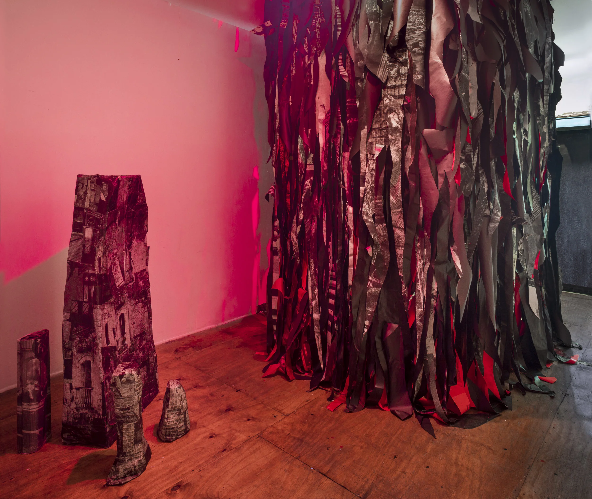 "Itinerant Maladies," 2018, Inkjet prints of colonial photos, paint, led lights, 11 x 11 x 7 feet 7 inches and "Buttress" (series), 2017-ongoing, Papier-mâché, dimensions variable