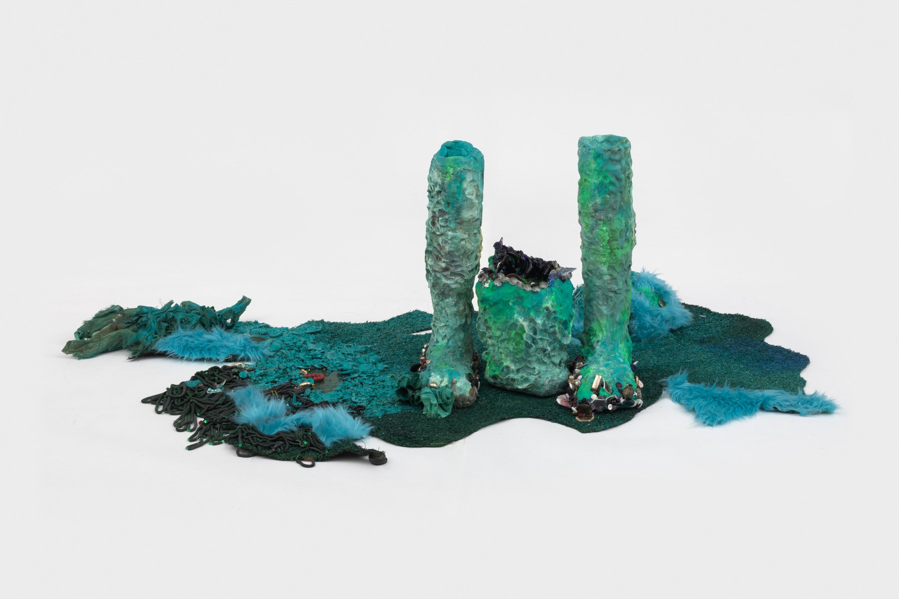 “a path along a part of hair (1),” 2023 astroturf, paint, resin, sequins, trim, beads, buttons 58 x 38 x 17 1/2 in