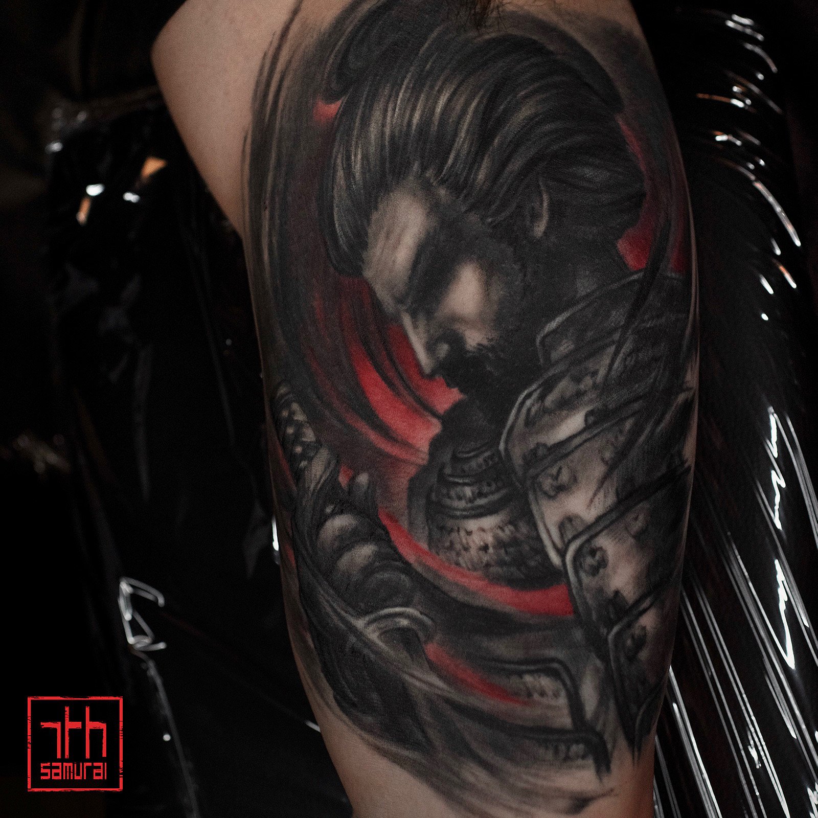 Japanese Samurai Men's bicep tattoo with red highlights artist: Kai at 7th Samurai. YEG Edmonton Alberta Canada 2020