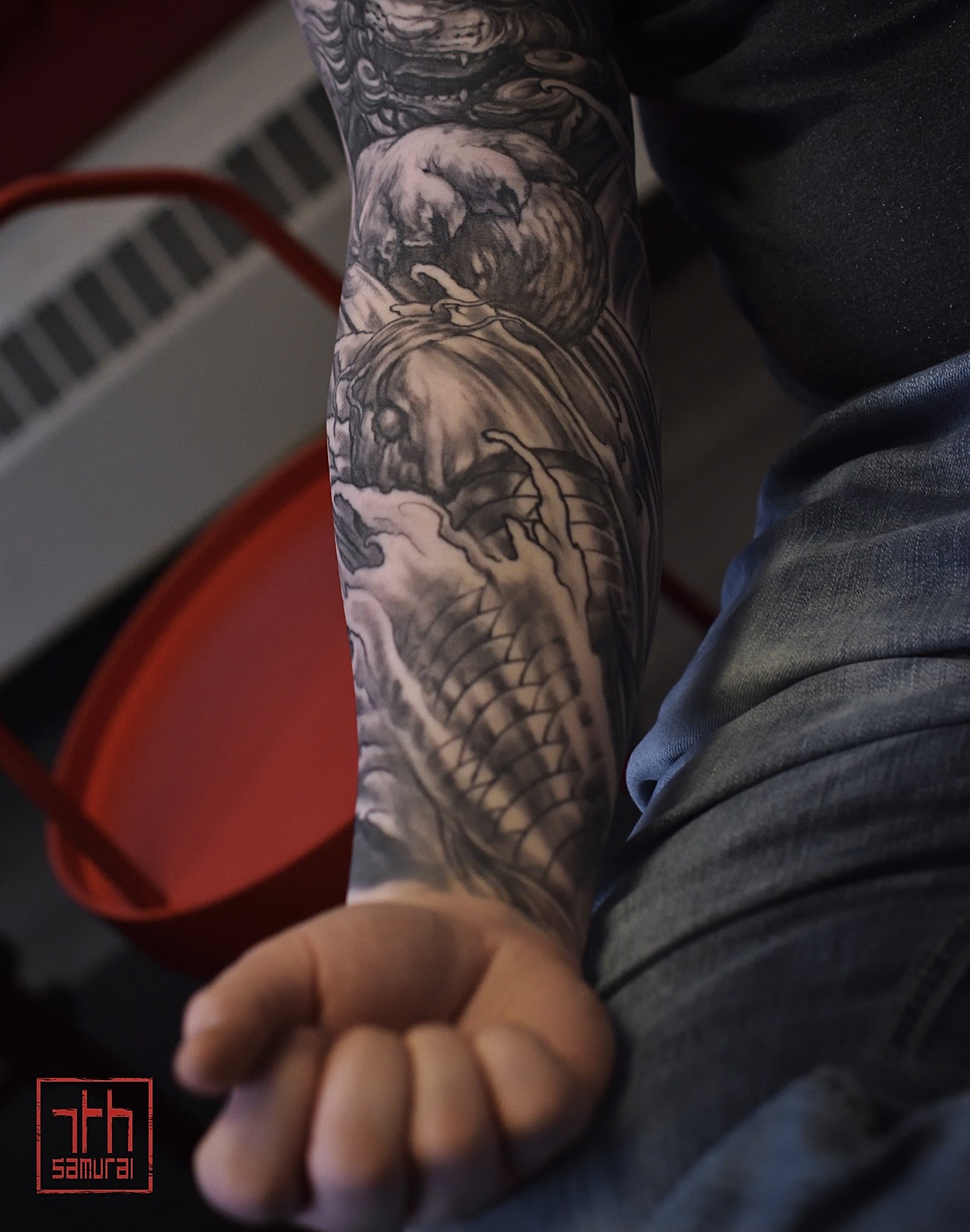 fudog + koi + dragon foodog  Men's neo japanese asian tattoo sleeve in waterfalls   (Tattoo artist: Kai at 7th Samurai. YEG Edmonton, Alberta, Canada) best asian tattoo artist 2020