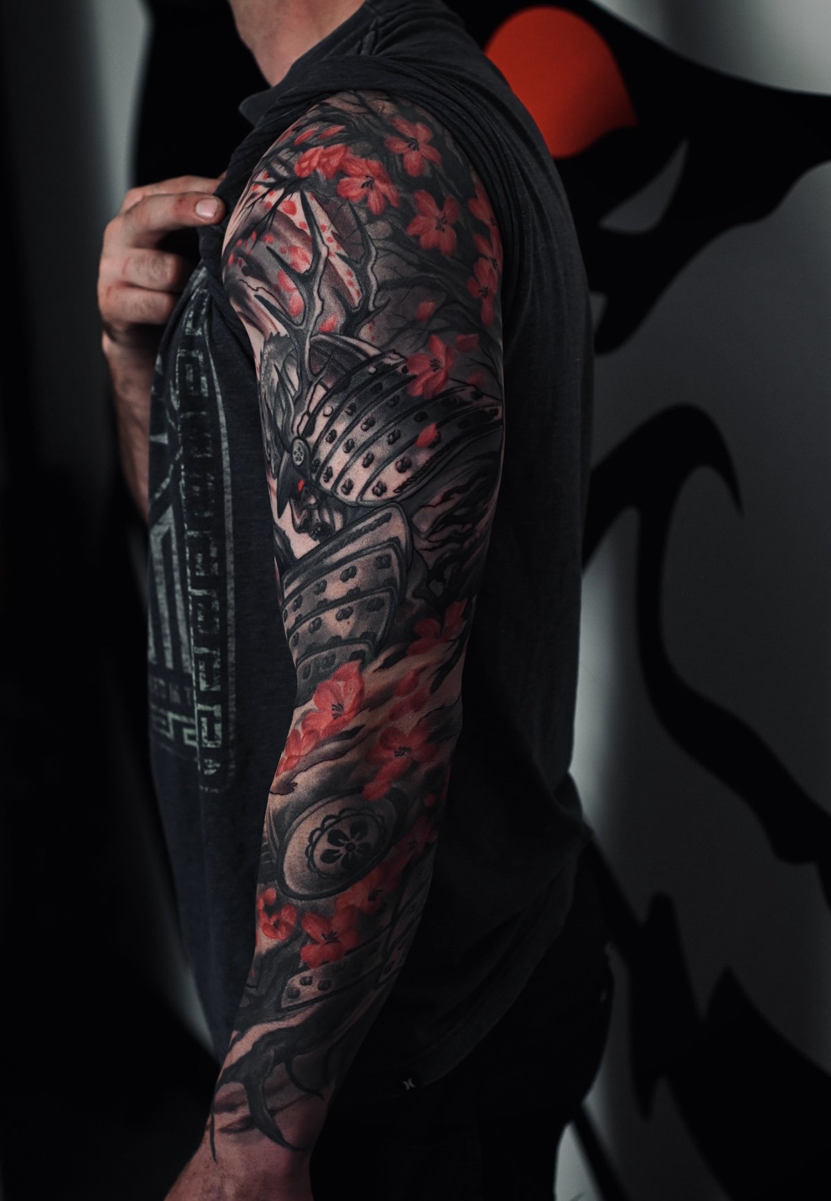 samurai growing cherry blossom tree roots abstract elements  Men's neo japanese sleeve tattoo with red highlights  asian Tattoo artist: Kai at 7th Samurai. YEG Edmonton, Alberta, Canada best 2023