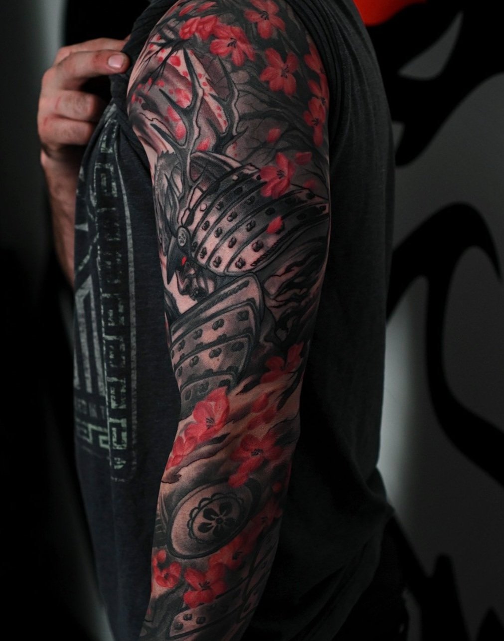 samurai growing cherry blossom tree roots abstract elements Men's neo japanese sleeve tattoo with red highlights  asian Tattoo artist Kai at 7th Samurai. YEG Edmonton Alberta Canada best 2023