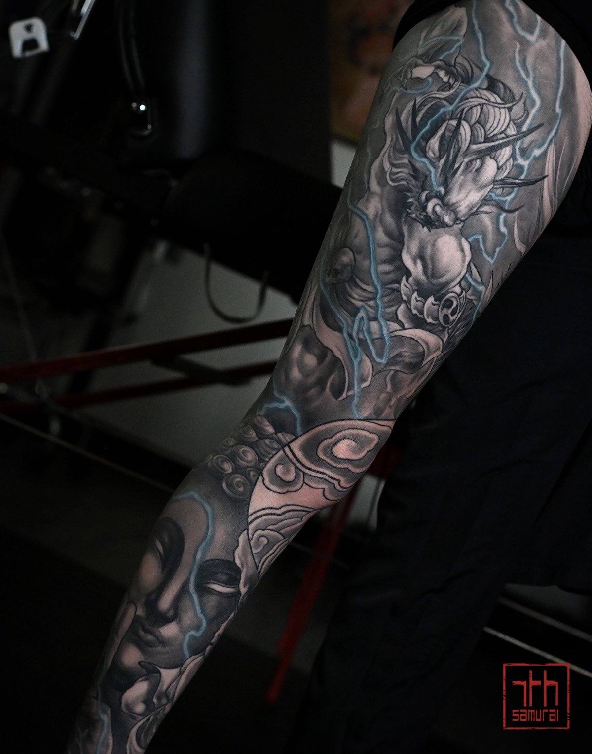 Raijin thunder god buddha  Men's neo japanese asian leg sleeve tattoo with blue lightning highlights  asian artist: Kai 7th Samurai. YEG Edmonton, Alberta, Canada 2023 best 2024 