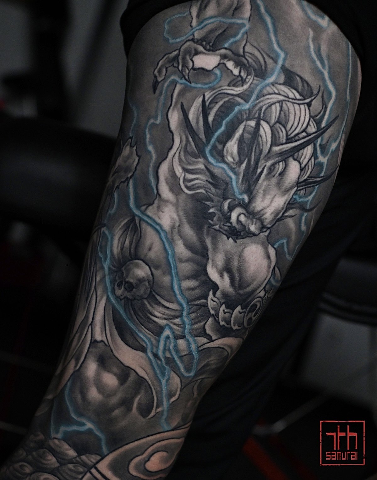 Raijin thunder god Fujin wind god dragon buddha  Men's neo japanese asian leg sleeve tattoo with blue lightning highlights  asian artist: Kai 7th Samurai. YEG Edmonton, Alberta, Canada 2023 best 2024 