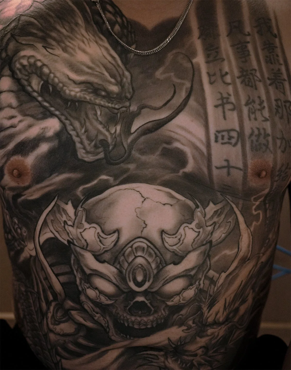 skeleton king Tibetan skull front chest Asian morbid piece tattoo Kai at 7th samurai Edmonton, Alberta, Canada 2026 st.albert Calgary Vancouver toronto