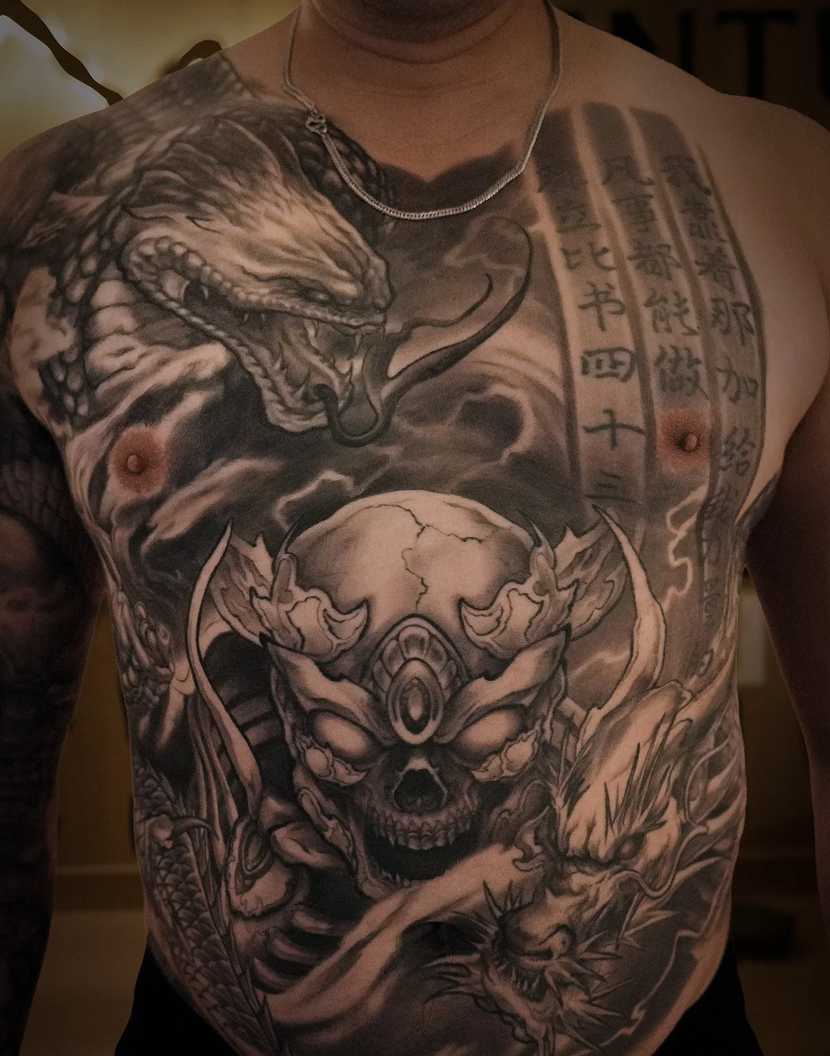 skeleton king Tibetan skull front chest Asian morbid piece tattoo Kai at 7th samurai Edmonton, Alberta, Canada 2026 st.albert Calgary Vancouver toronto