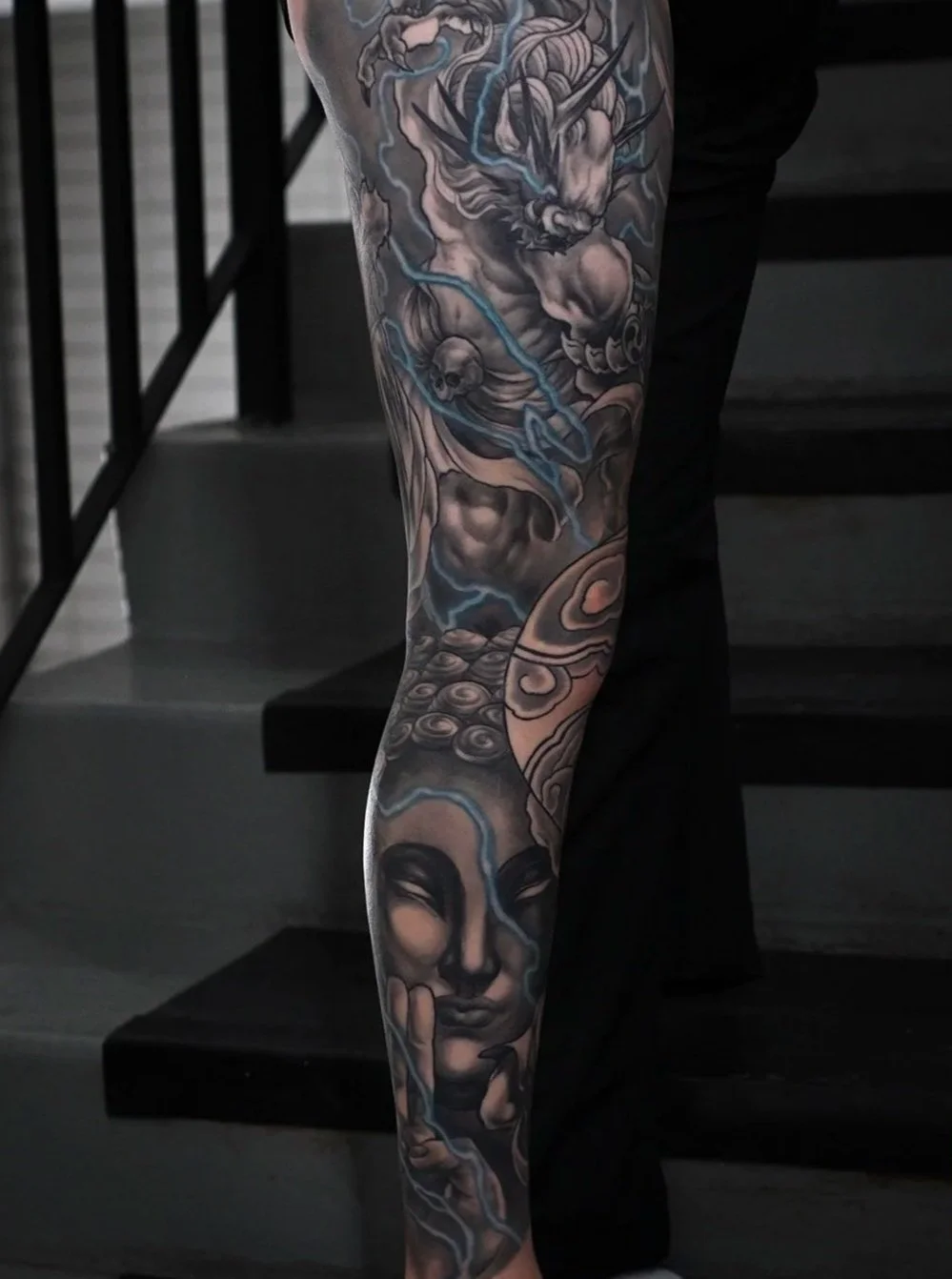 Raijin thunder god Fujin wind god dragon buddha  Men's neo japanese asian leg sleeve tattoo with blue lightning highlights  asian artist: Kai 7th Samurai. YEG Edmonton, Alberta, Canada 2023 best 2024 