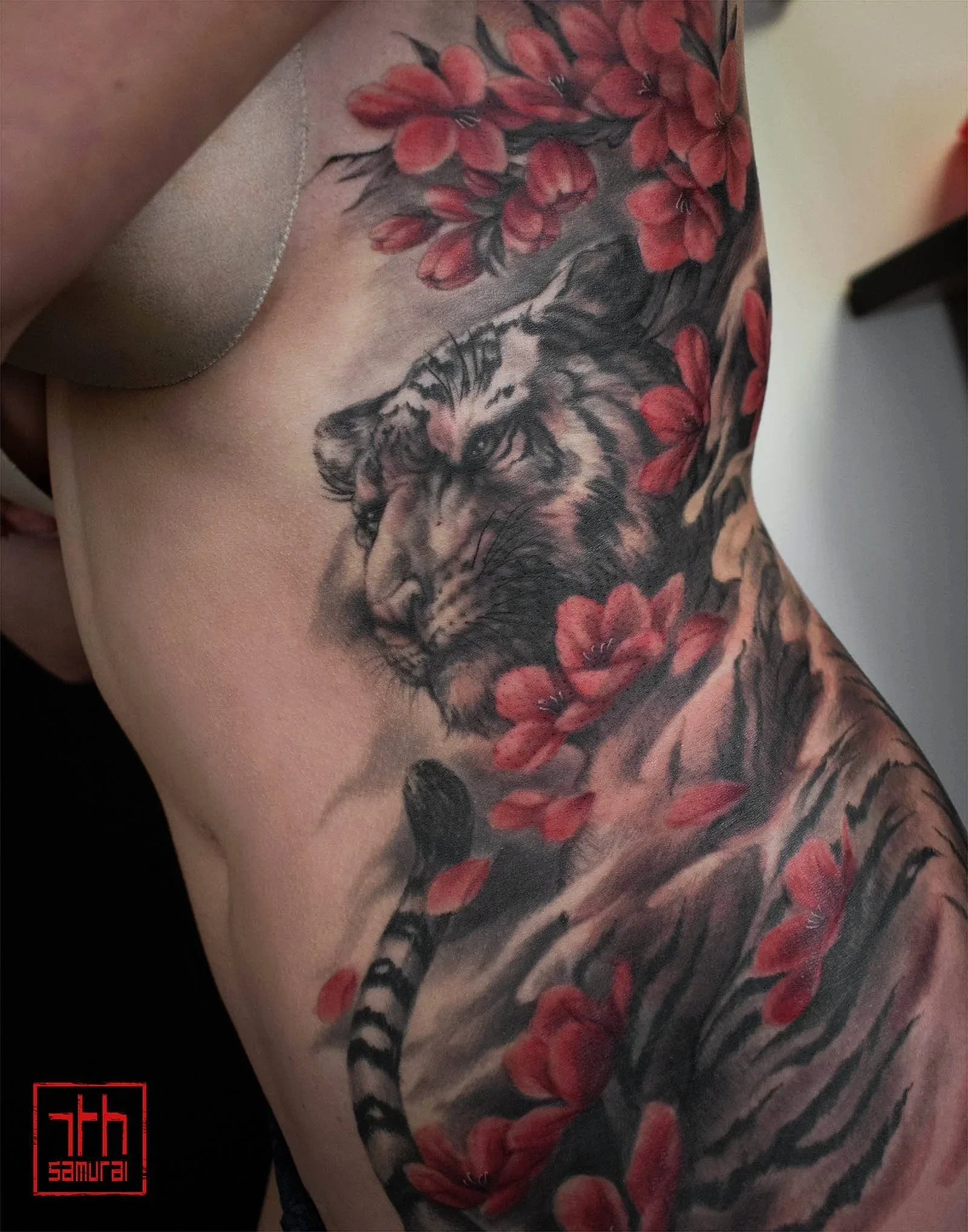 Women's calm tiger cherry blossom flowers red highlights rib kai 7th samurai edmonton Canada best asian japanese tattoo 2020