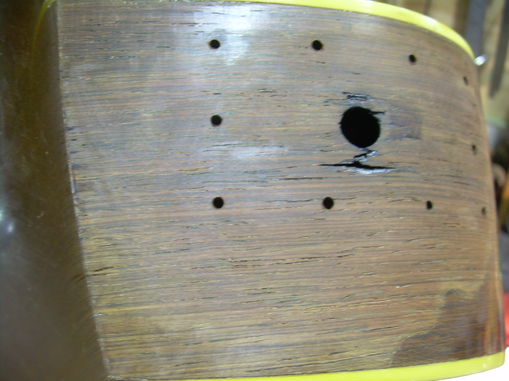 Unthinkable nowadays, but at the time adding a pickup through the side of a 1937 D-28 Martin Dreadnought was an upgrade.