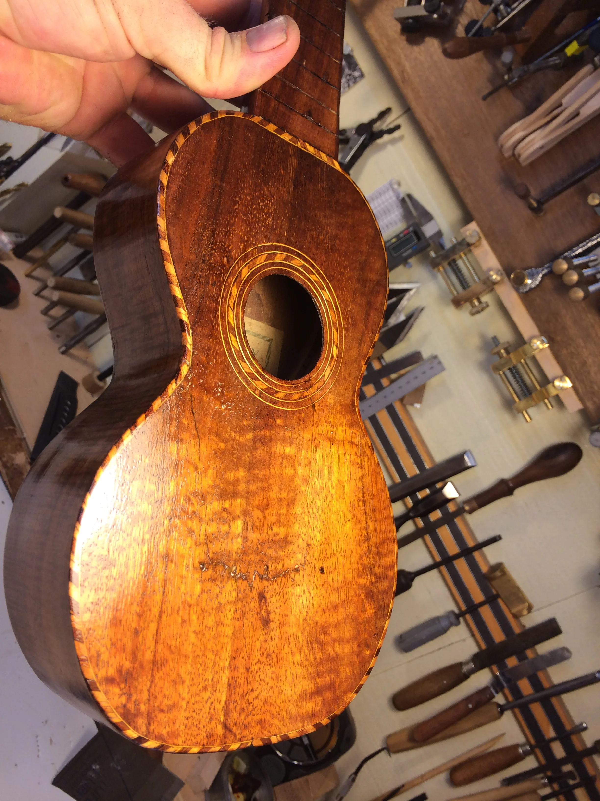 Top cracks repaired with hot hide glue, ready for some french polishing.