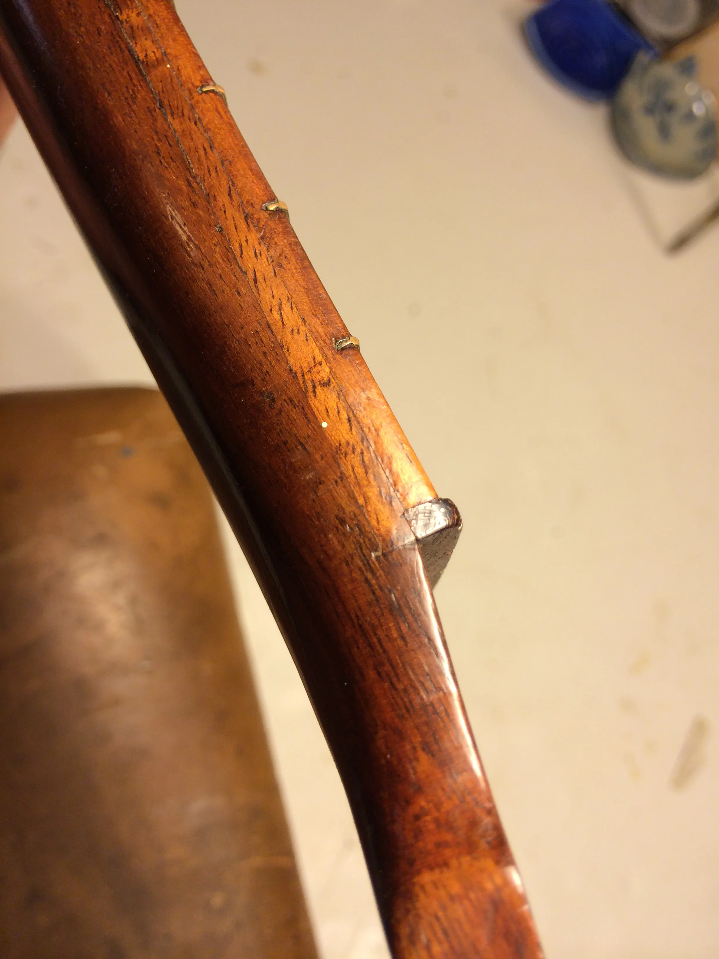 An inquiry to the side of the neck offered up some curious details. Clearly a second piece of Koa beneath the top fingerboard.