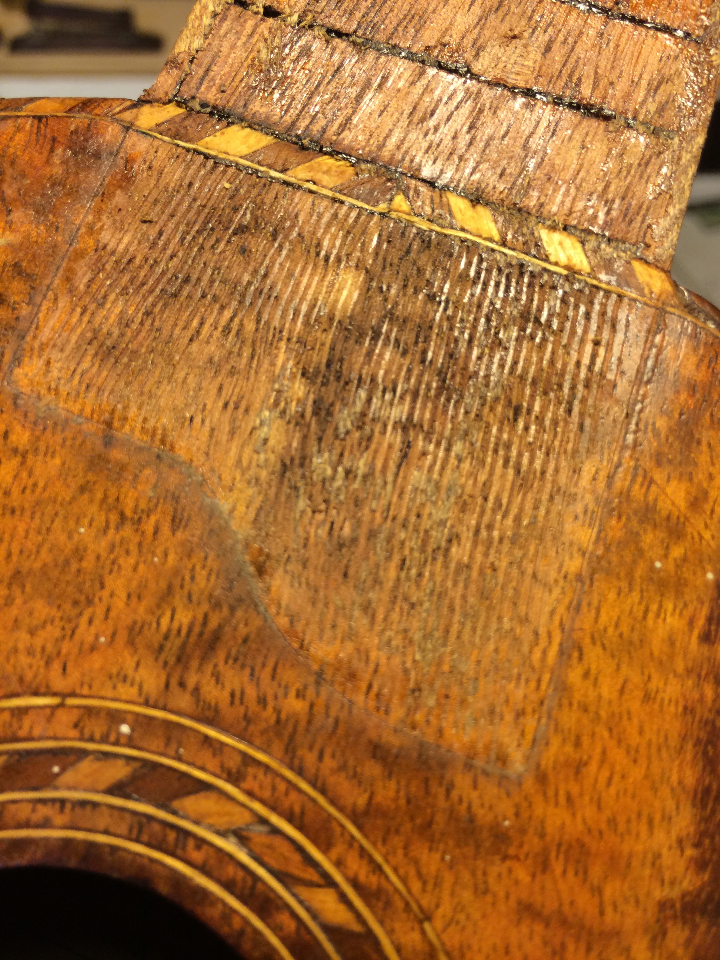 The real restoration begins. The person that added the fingerboard, likely in the 30s or 40s had scored the top when preparing for glue, this would be a challenge to make disappear.