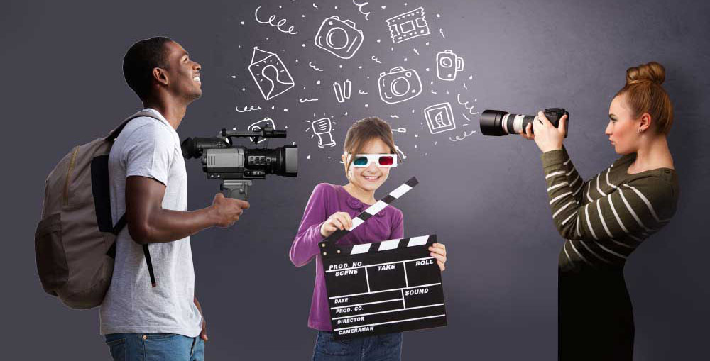 Two young people with cameras and a kid with a clapboard, ready to enter the contest.