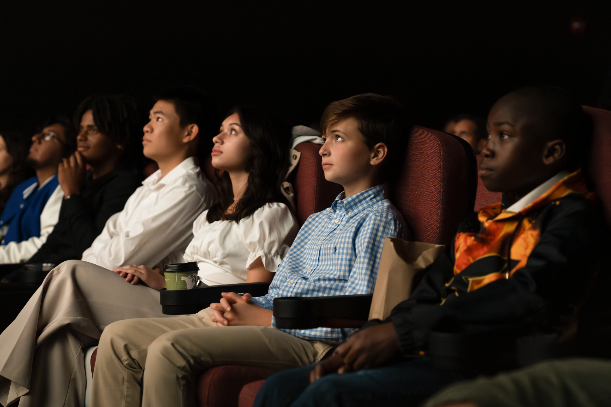 young filmmakers watching a movie in a theater