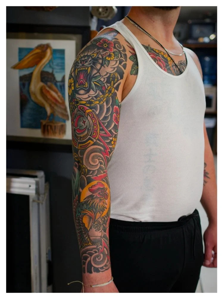 Full color American traditional sleeve tattoo by Chris Cockrill at Remington Tattoo in San Diego