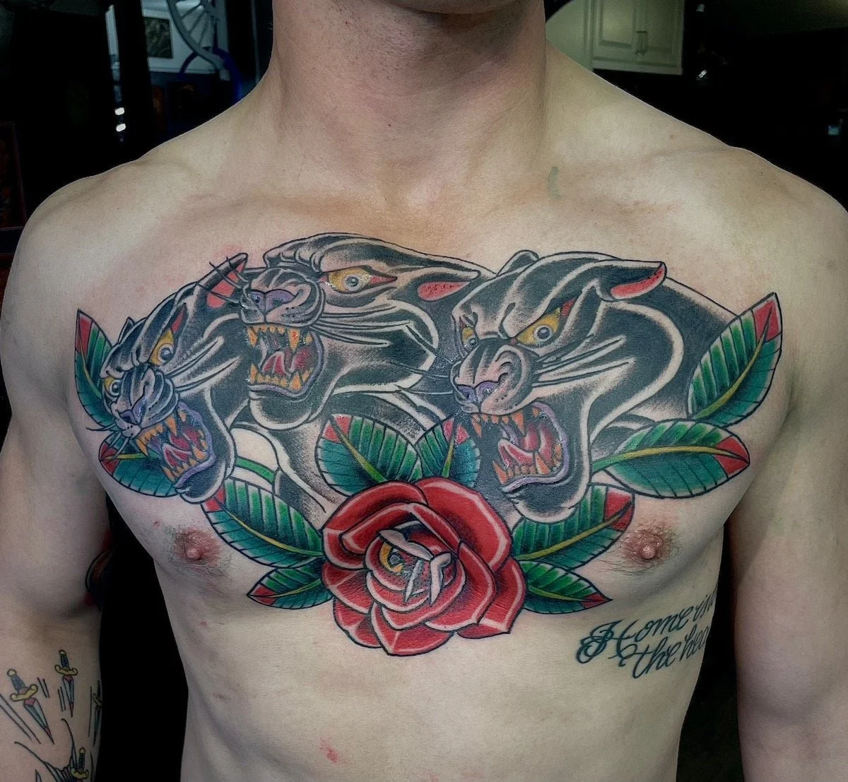 American traditional tattoo in San Diego: panther and rose chest piece by Chris Cockrill