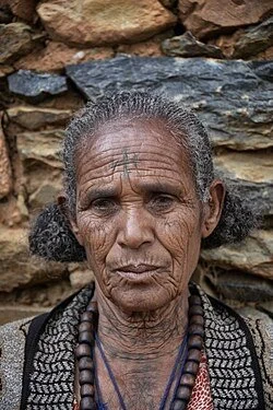 Ethiopian Orthodox woman from Tigray with traditional Niksat face markings