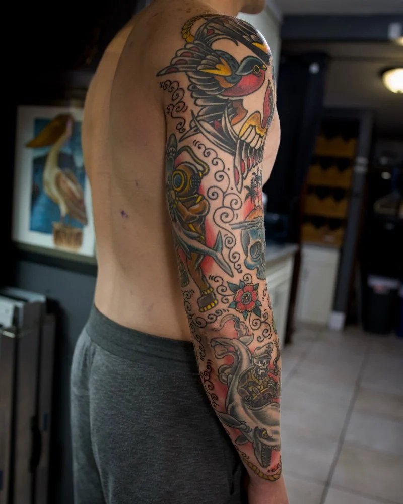 Traditional American sleeve tattoo by Chris Cockrill