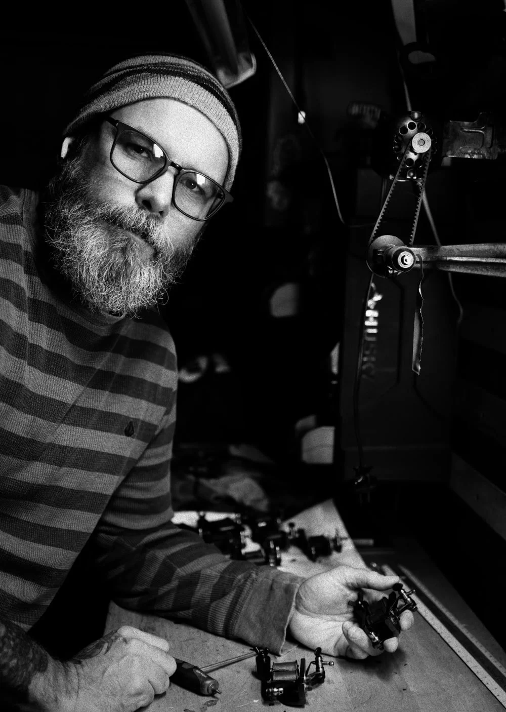 Tattoo Artist at workbench in San Diego