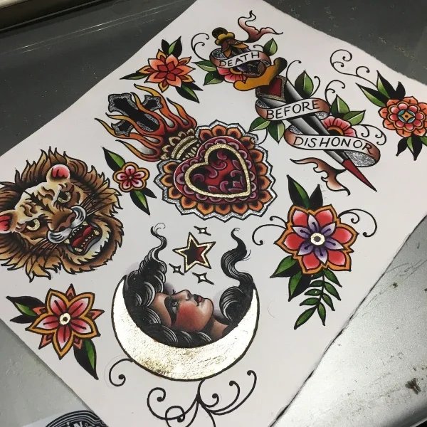 A sheet of American Traditional tattoo flash with gold and silver leaf, painted by Chris Cockrill in San Diego.